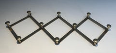 Brass accordion wall coat rack. French work. Circa 1970