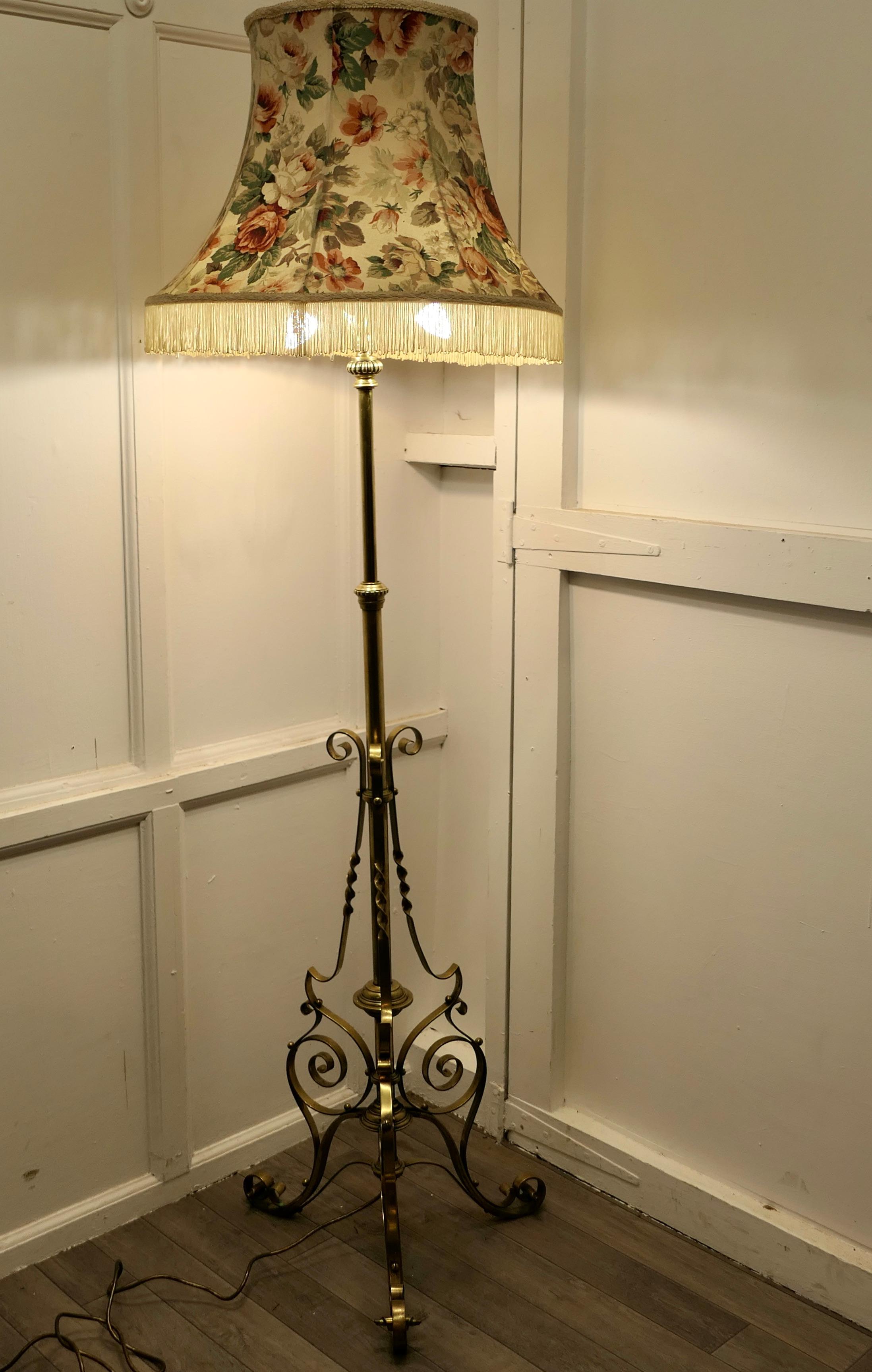 Brass adjustable arts and crafts floor lamp

This is a very attractive piece, the lamp has a telescopic action and a decorative wrought brass base also the upright column can be extended to raise the height of the lamp
I have shown the lamp with