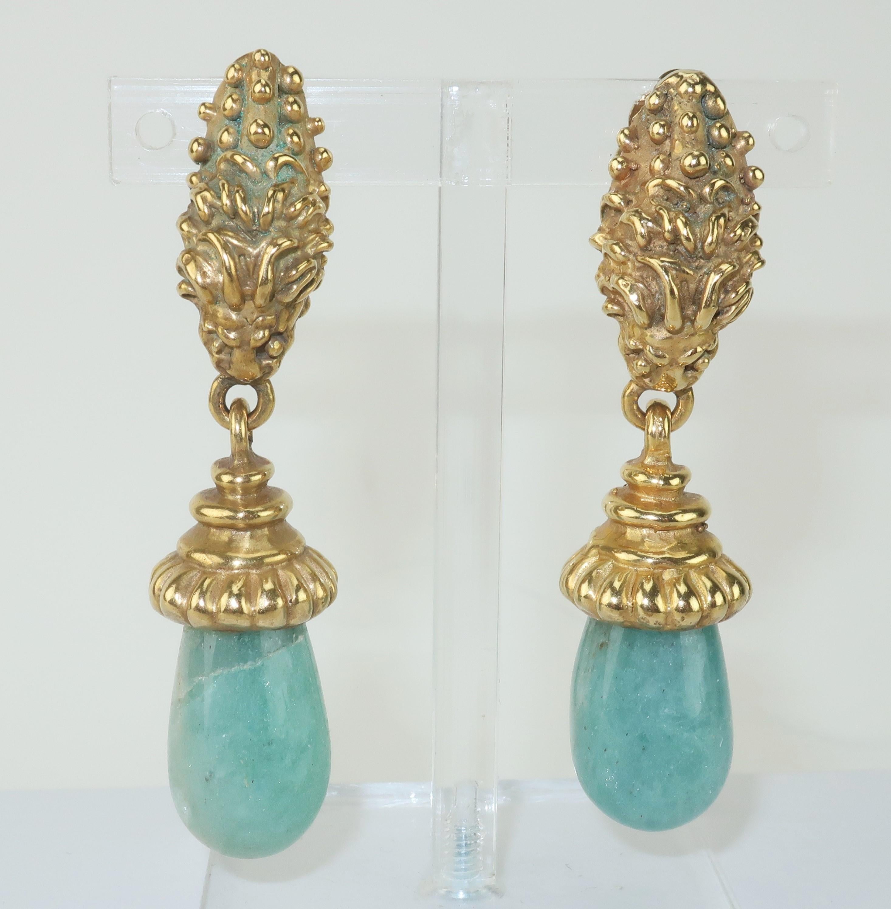 1980’s brass and sea foam green agate clip on earrings.  The brass base is in the highly detailed form of a foo dog or lion suspending a teardrop shaped agate dangle.  No hallmarks though beautiful made with quality details. 
CONDITION
Very good