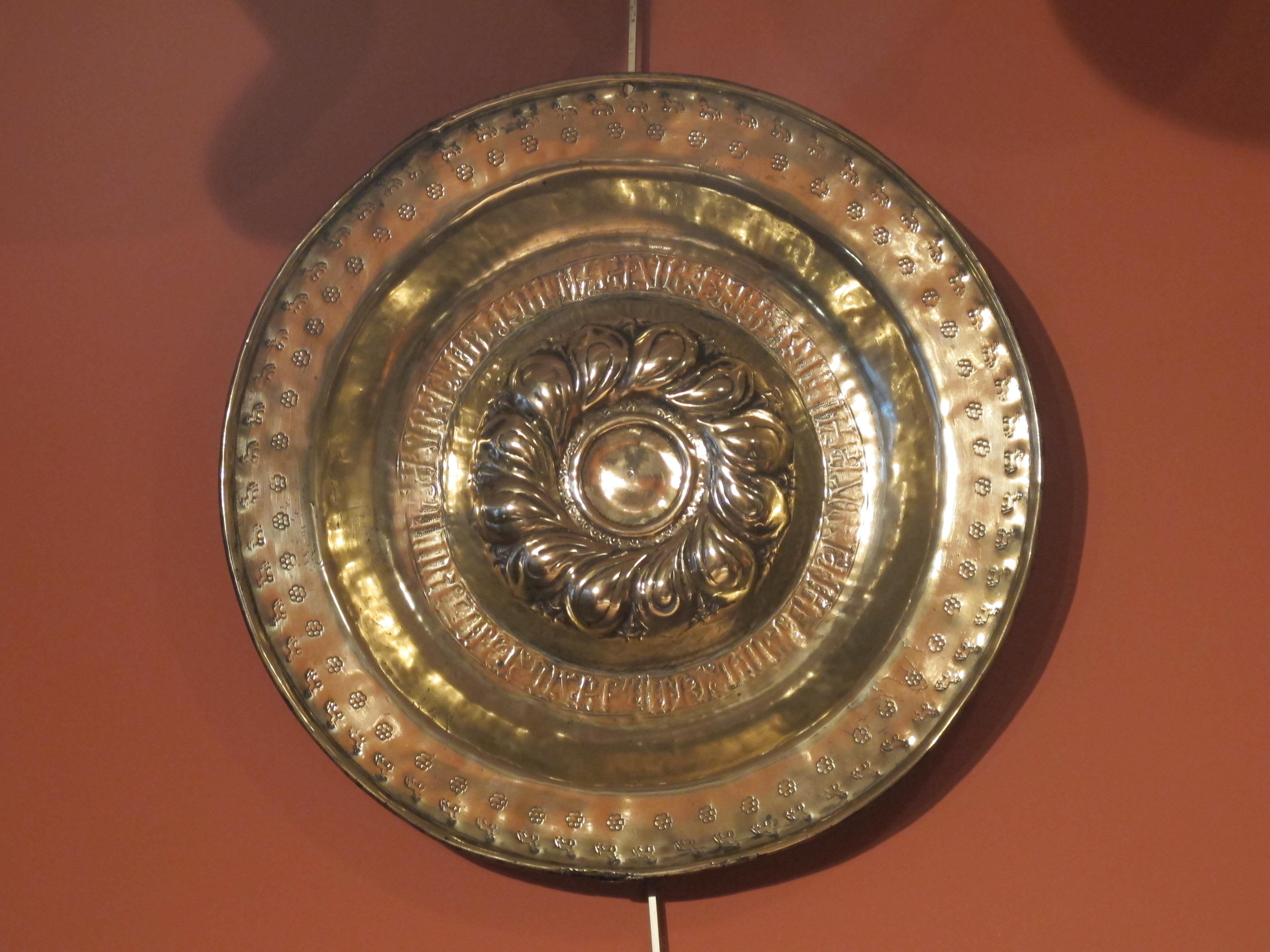 Origin: South Of Germany, Nuremberg
Period: Late 15th–early 16th century

Diameter 43.5 cm

Embossed and engraved brass

This is in Belgium, in the city of Dinant during the 12th and 13th centuries, that the ‘copper beaters’ corporation