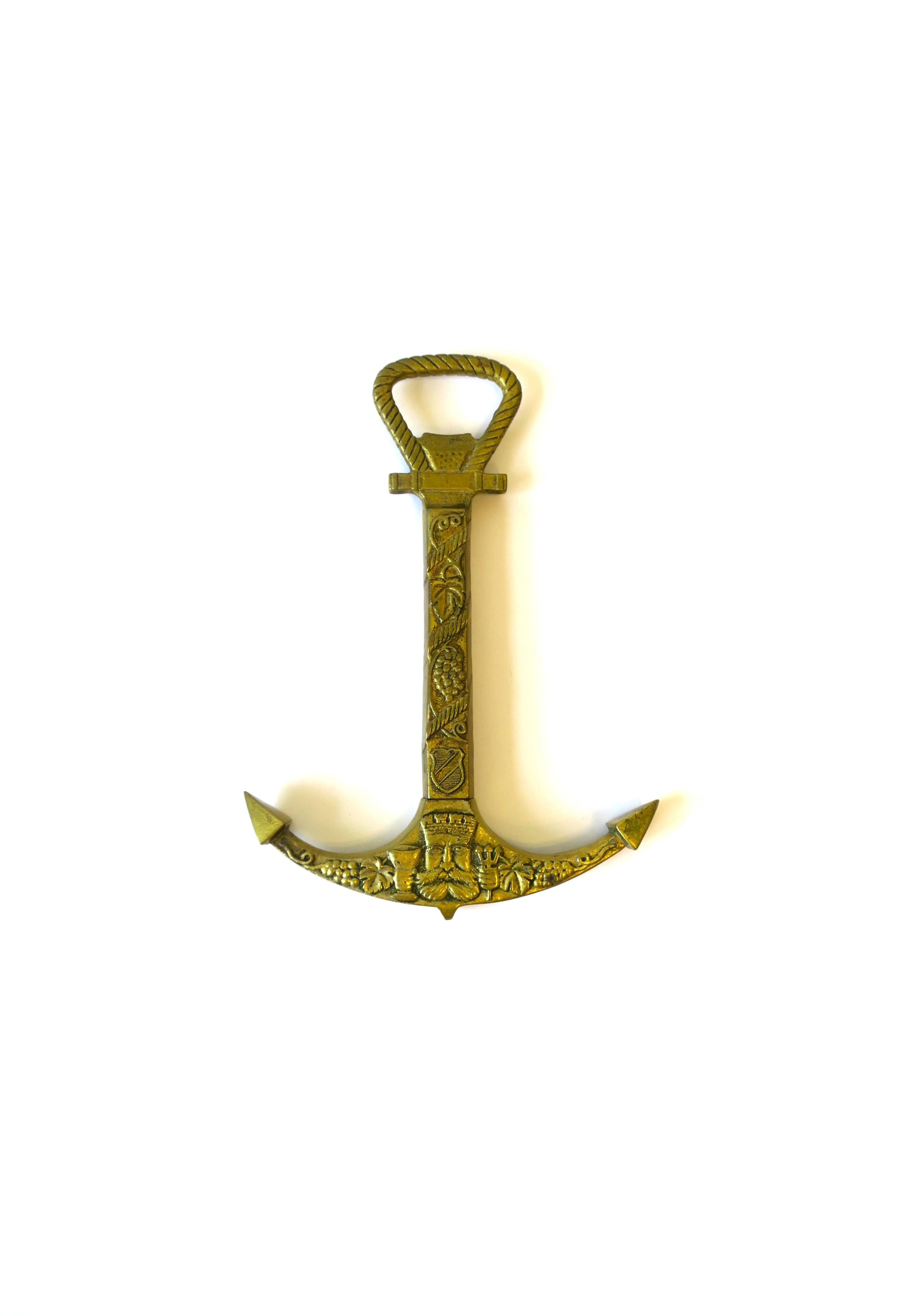 A vintage solid brass 'anchor' wine and bottle opener, circa mid-20th century, Scandinavia or Germany. A pull back of anchor reveals corkscrew, with bottle opener at top. Design details include 'rope' design at top, grapes, vines and leaves on front
