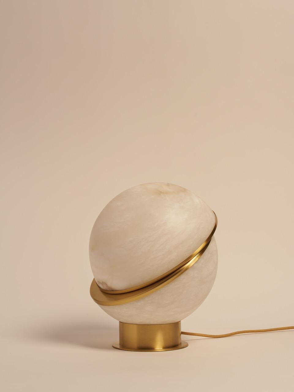 Brass And Alabaster Offset Globe Table Lamp by MATLIGHT Milano
Dimensions: D 30 x W 30 x H 36 cm.
Materials: Brass and alabaster.

Handmade In Italy. All our lamps can be wired according to each country. If sold to the USA, it will be wired for the