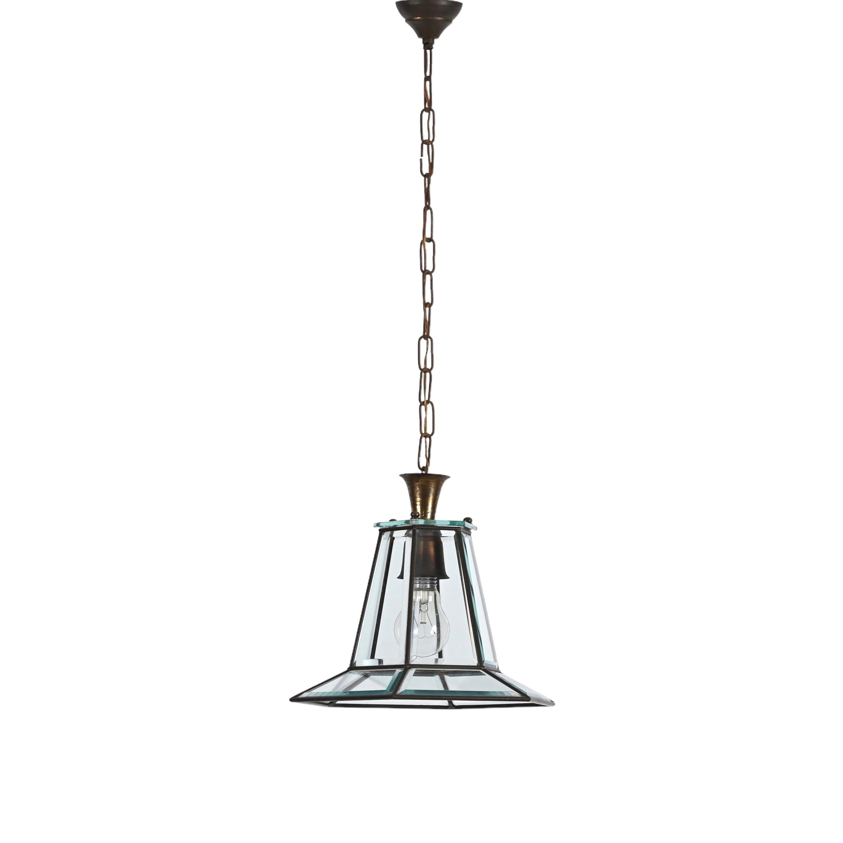 Superb brass and bevelled glass hexagonal chandelier. This amazing pendant light was designed in Italy and inspired by the work of Adolf Loos during the 1950s.

This piece is fantastic thanks to a splendid and clear suspension showing six faceted