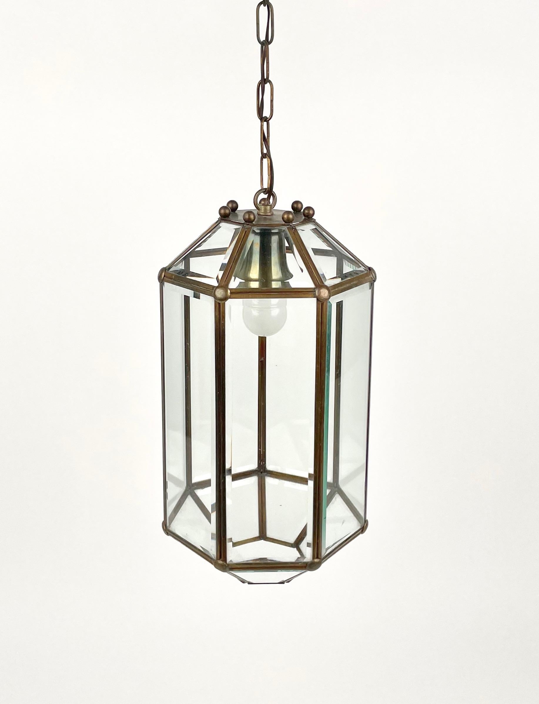 Chandelier Pendant Lantern in brass and beveled glass in the style of Adolf Loos.

The stunning and clear cut pendant shows twentyone facetted clear glasses in a brass frame. 

A unique light.

Made in Italy in the 1950s.

Measures: Height