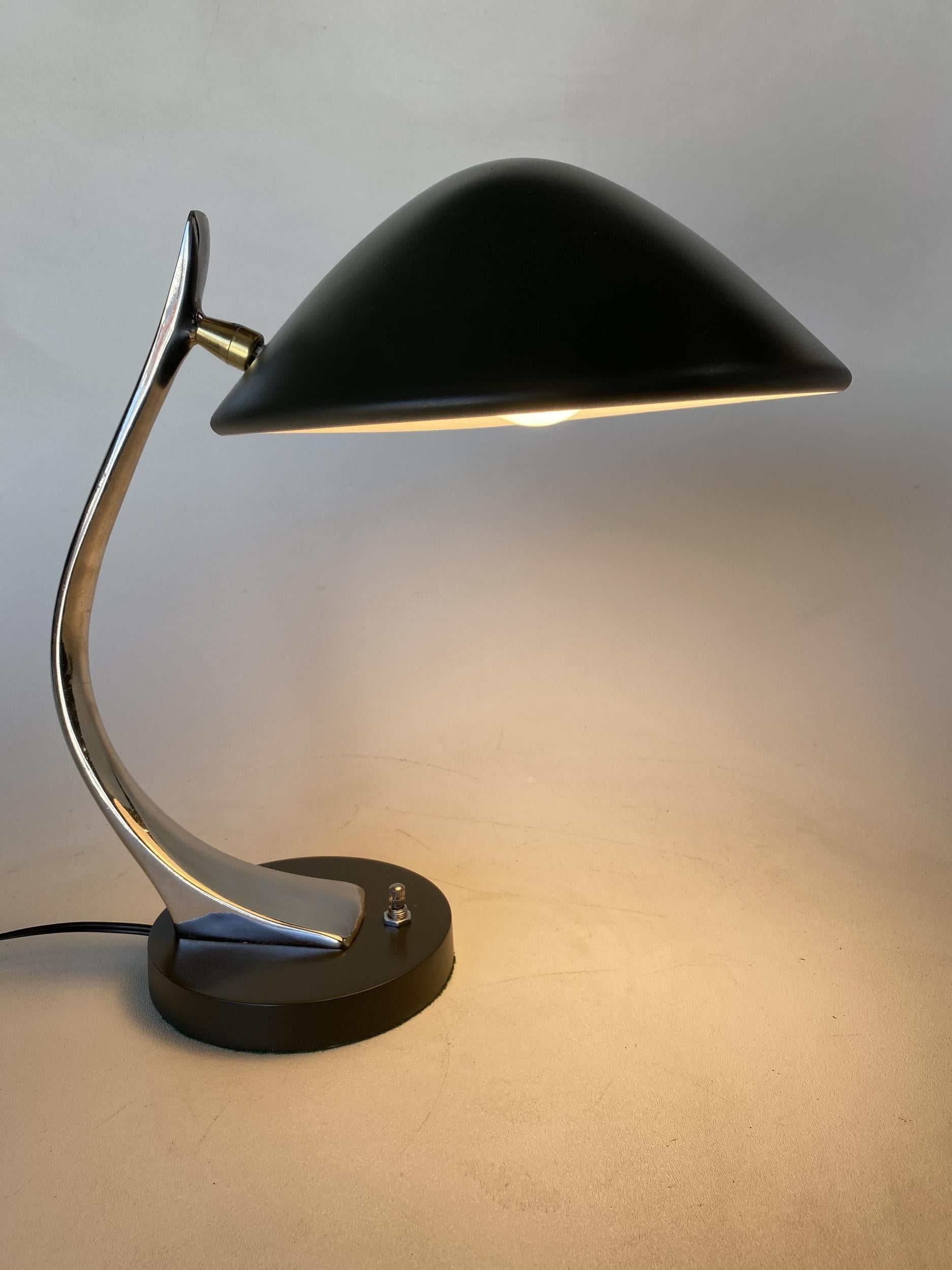 High style cobra desk lamp by Laurel Featuring heavy mid-century styling with a black enamel shade and base and freeform solid brass steam.