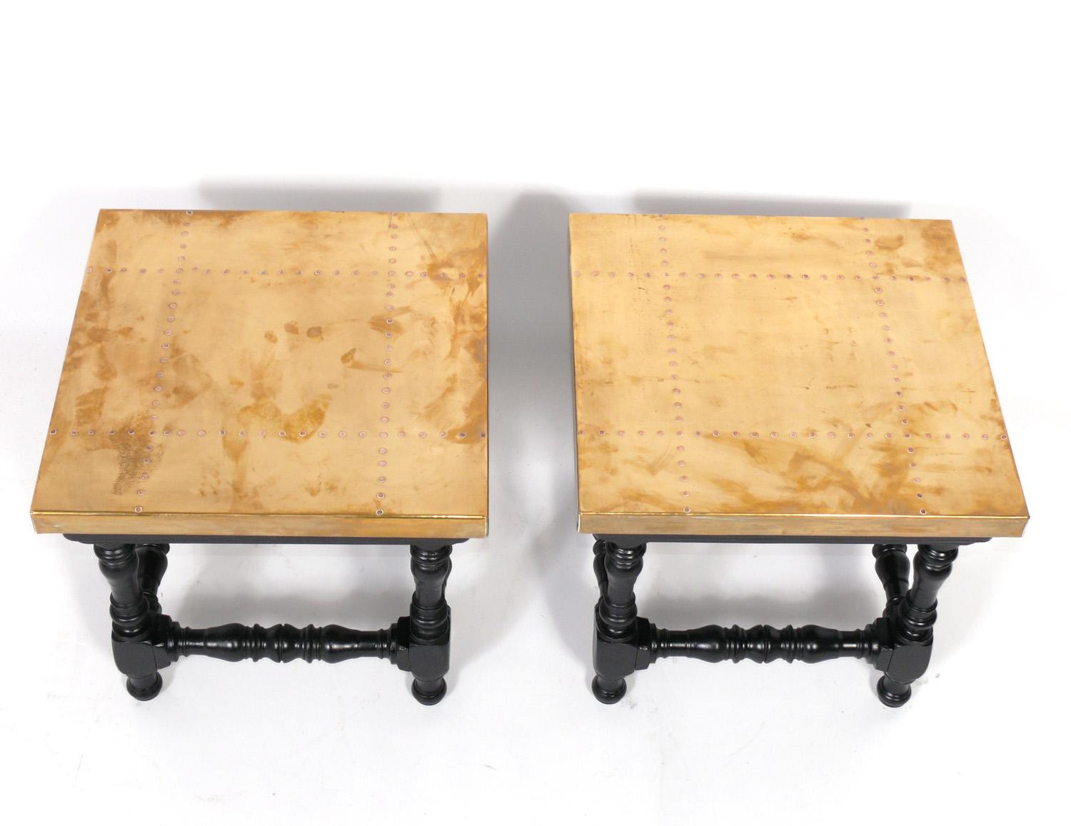 Brass and black finished wood tables, probably by Sarreid, circa 1960s. They are a versatile size and can be used as side or end tables, or as night stands.