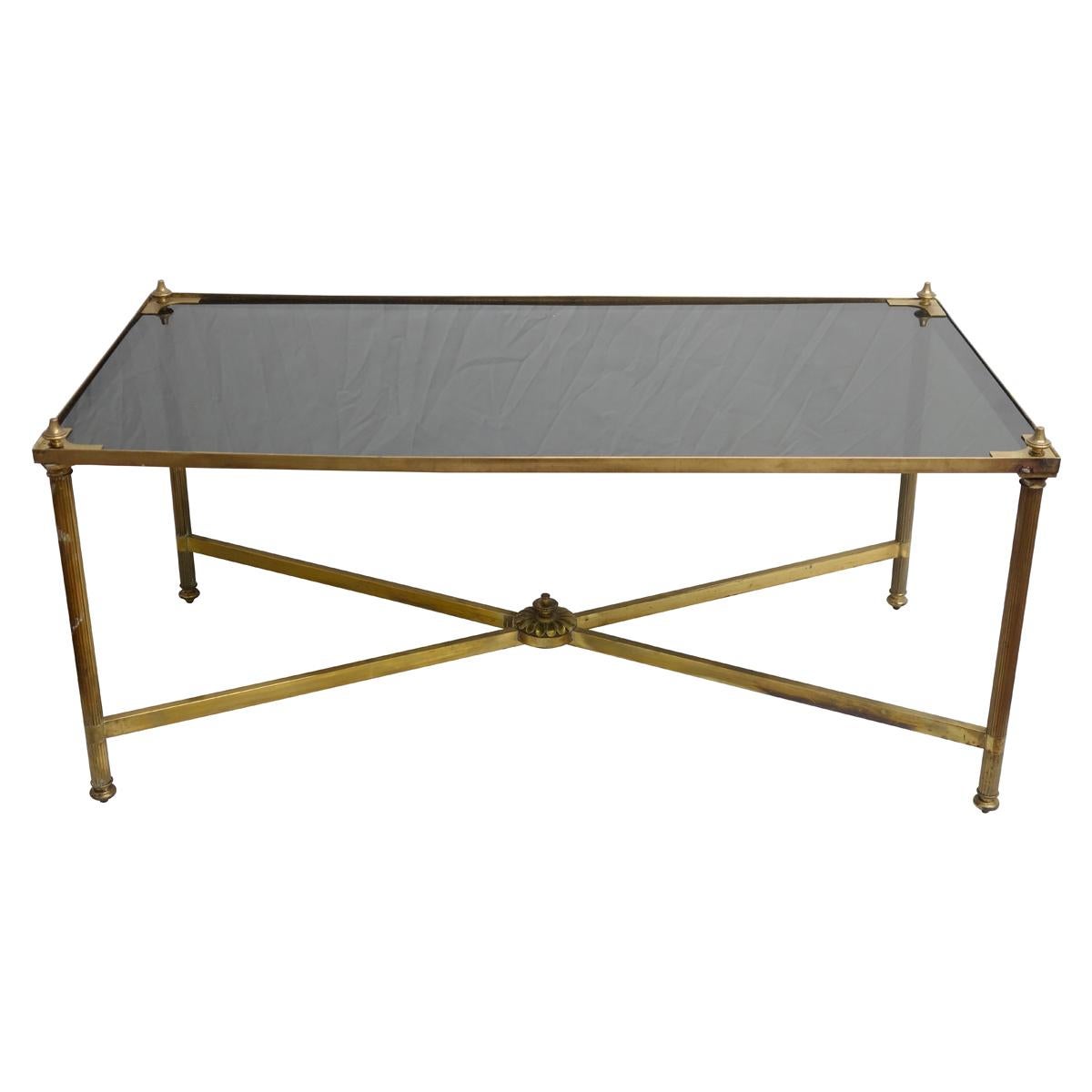 Maison Jansen midcentury coffee table, manufactured in brass and black glass top.