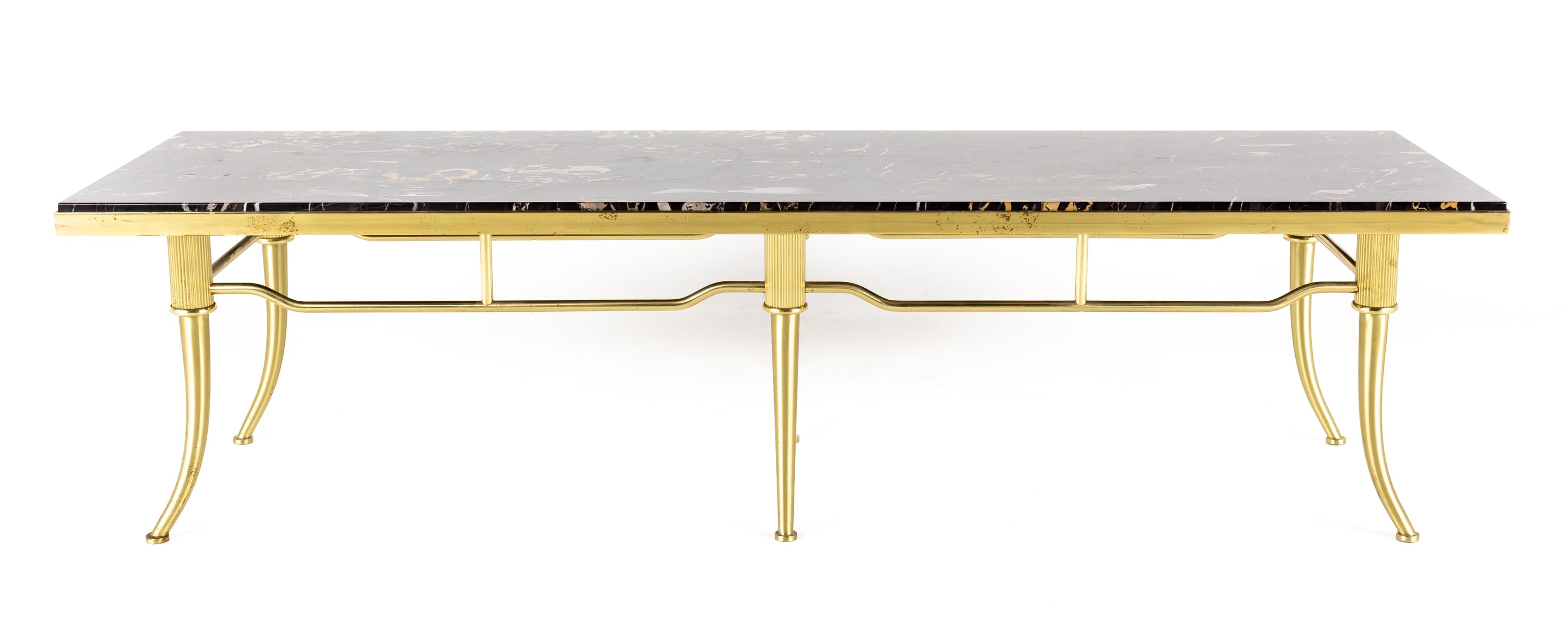 Brass and black marble coffee table

This table measures: 60 wide x 18 deep x 16 inches high

This table is in Great Vintage Condition with minor marks, dents, and wear.

About Photos: We take our photos in a controlled lighting studio to show as