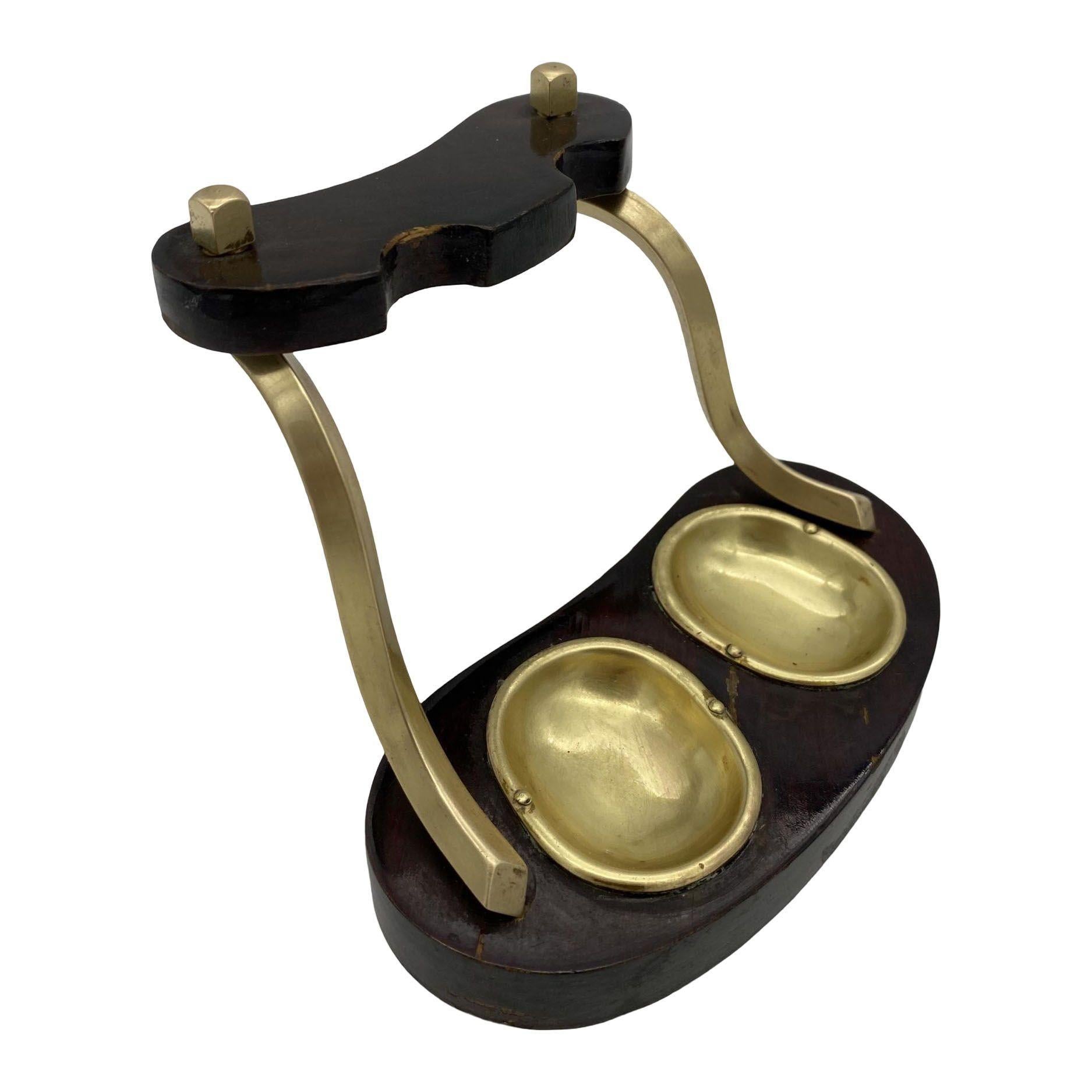 Brass and bloodwood pipe holder by Dunhill with silver and wood pipe by Medico.

Measures: Holder: 4.5