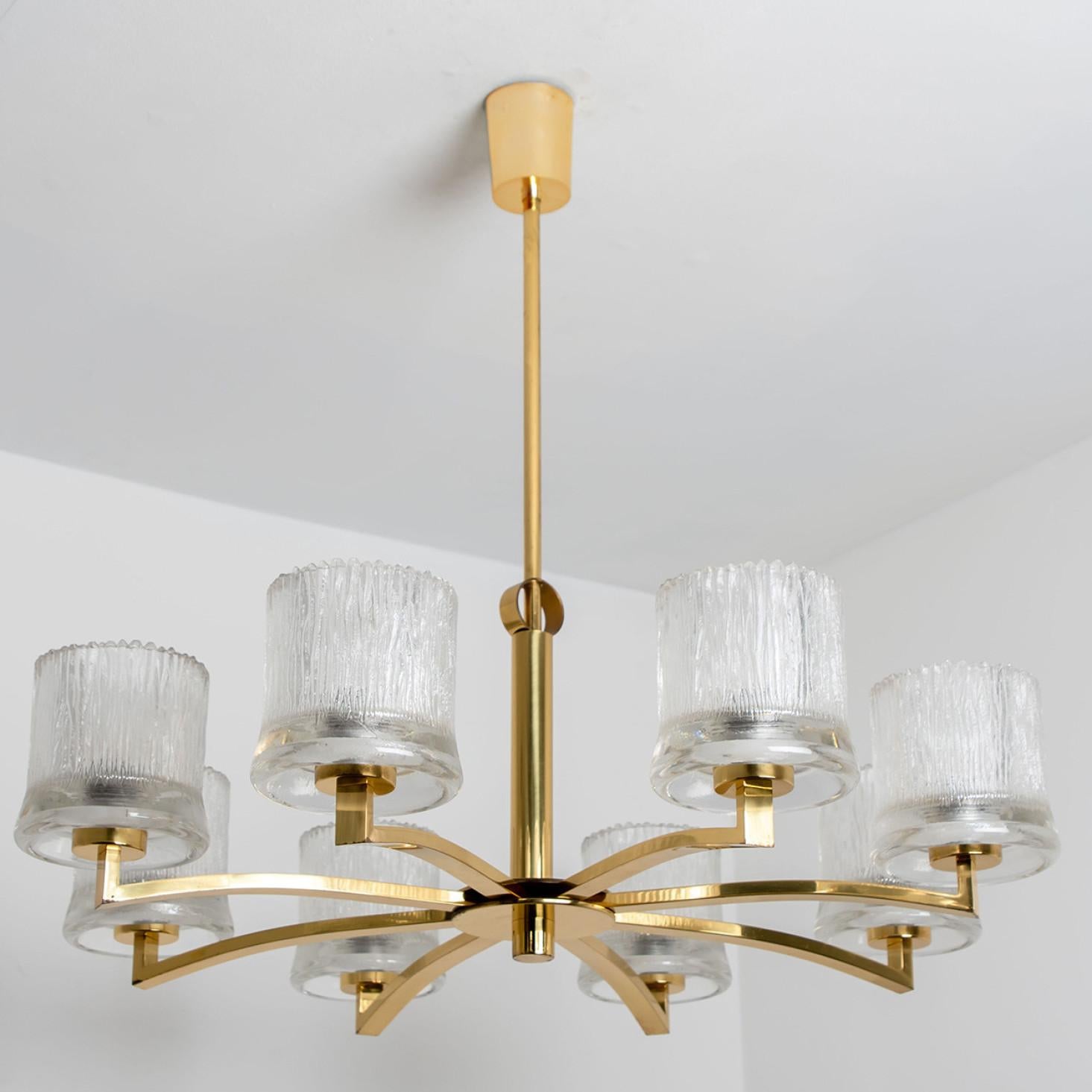 Beautiful chandelier by Glashutte Limburg. Manufactured in Germany around 1960.
With beautiful glass shades and brass details on a brass mounting hardware.
Illuminates beautifully.

Measures:
H 27.56 in. x D 29.53 in.
H 70 cm x D 75 cm

The