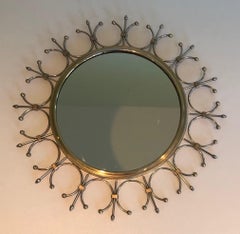 Espejo Sunburst de latón y acero cepillado. Obra francesa, circa 1970
