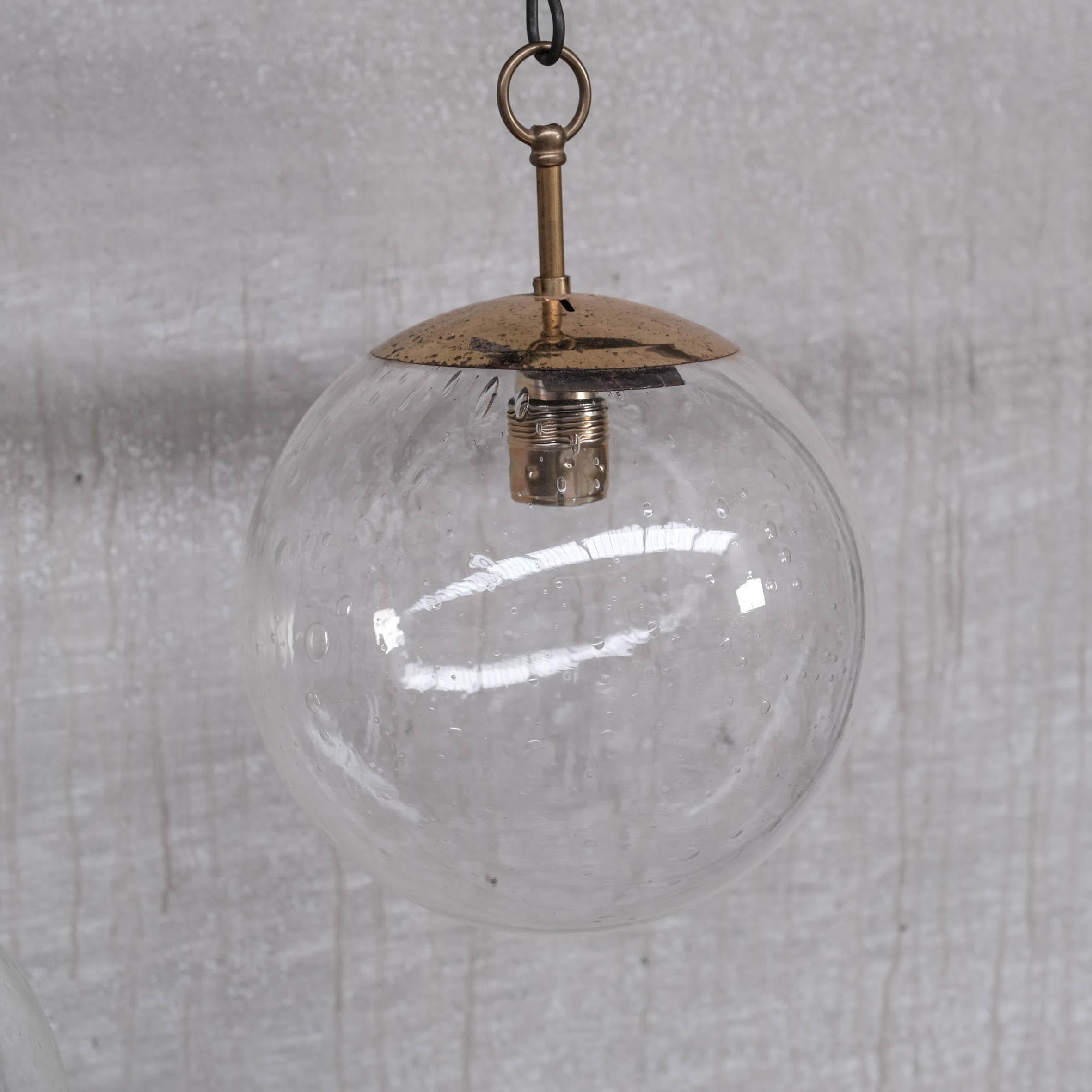 Mid-20th Century Brass and Bubble Glass Mid-Century Pendants, '3 Available' For Sale