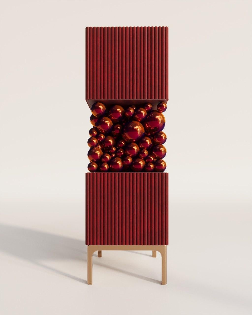 Brass And Burgundy Bubbles Decorative Cabinet by PANOPTIKUM COLLECTIONS
Dimensions: D 55 x W 55 x H 190 cm.
Materials: MDF,  brass paint, and LED lighting.

The “Bubbles collection” is an example of an emotional design that appeals to our inner