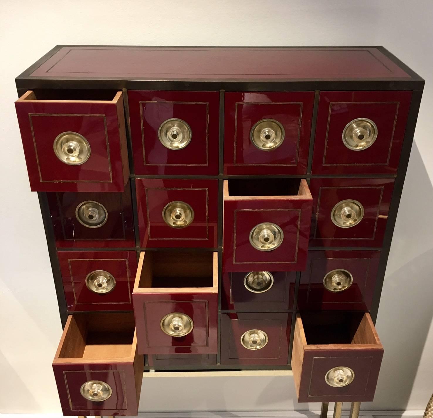 Mid-Century Modern Brass and Burgundy Red Cabinet with 16 Drawers in the Style of Willy Rizzo