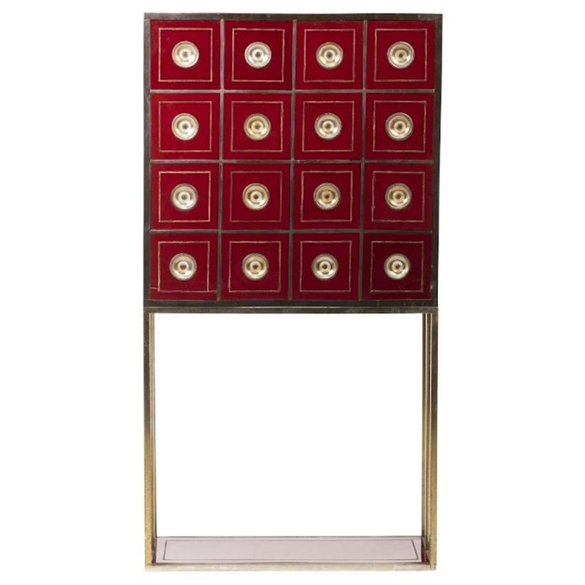 Brass and Burgundy Red Cabinet with 16 Drawers in the Style of Willy Rizzo