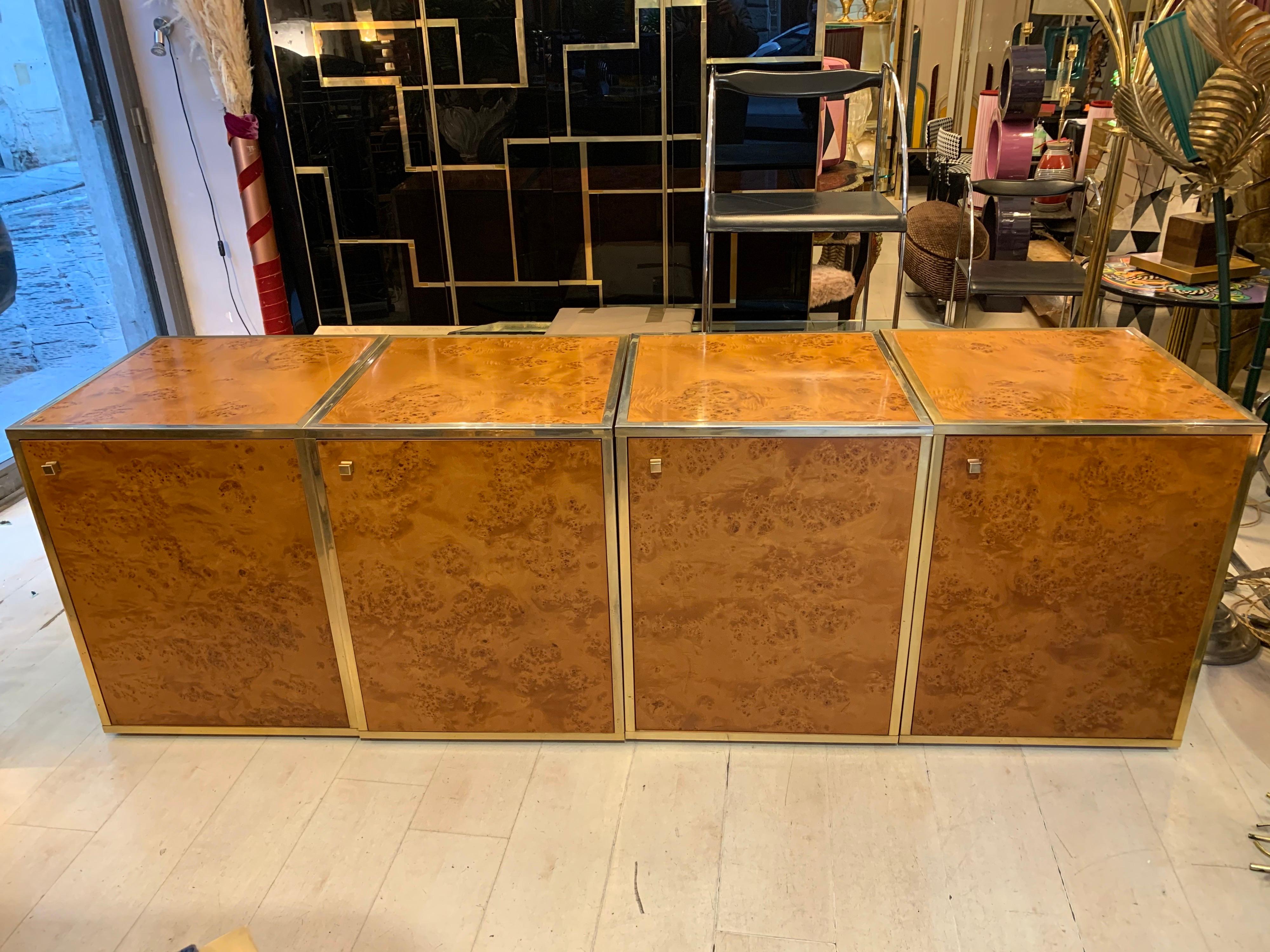 Brass and burl wood sectional credenza compose of four separate pieces, it is basically the result of four pieces put together with a variety of possible options, broken into different pieces it can be divided into two pieces of furniture (each made
