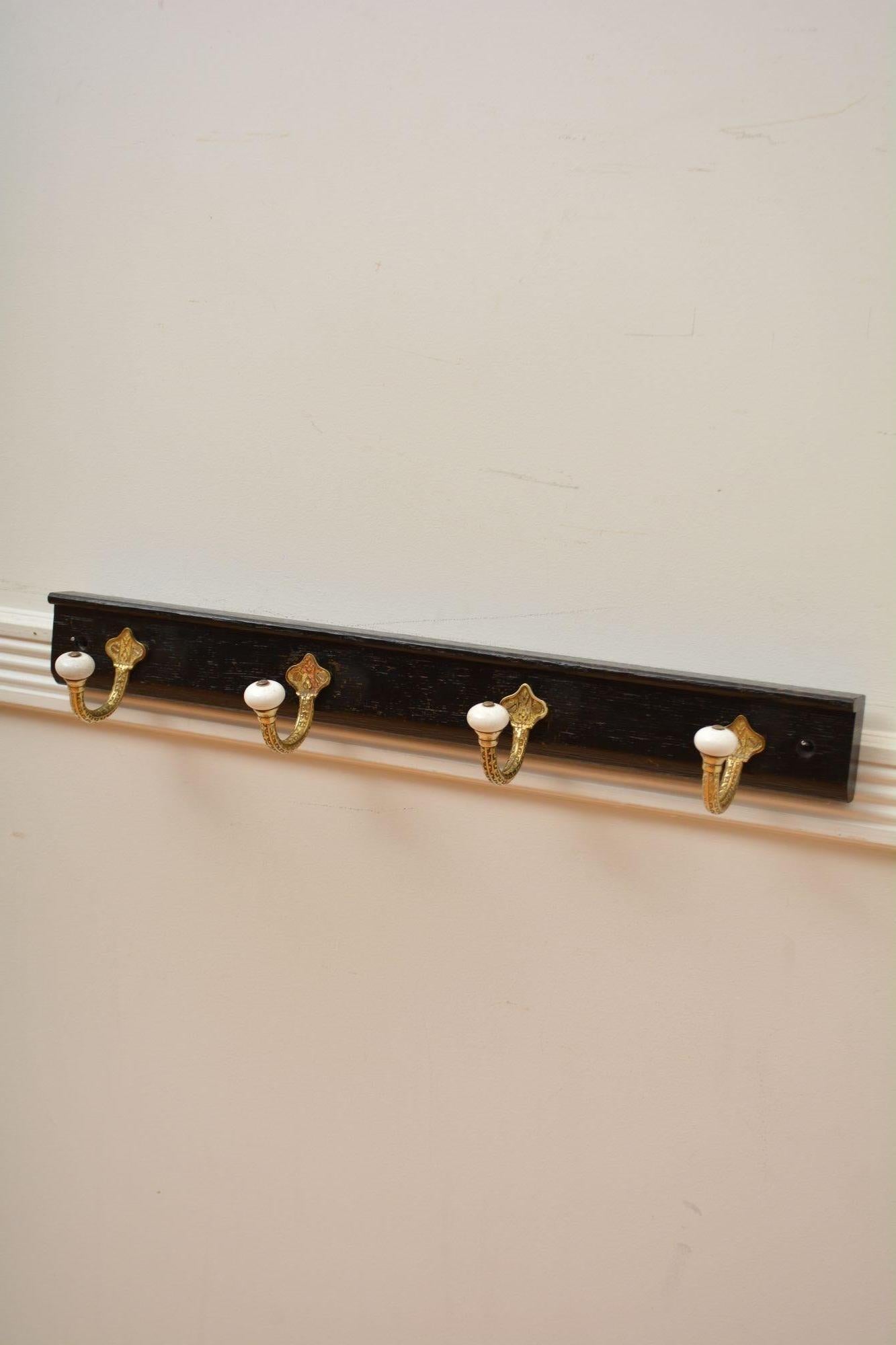 English Brass and Ceramic Coat Hooks on Oak backing Coat Rack For Sale