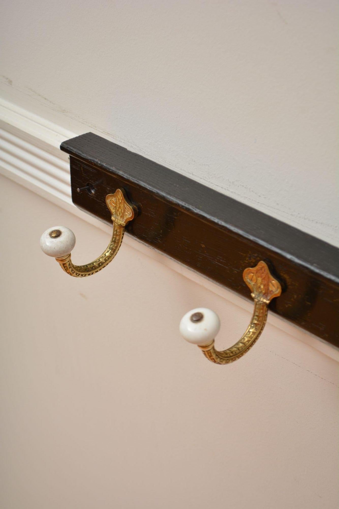 19th Century Brass and Ceramic Coat Hooks on Oak backing Coat Rack For Sale
