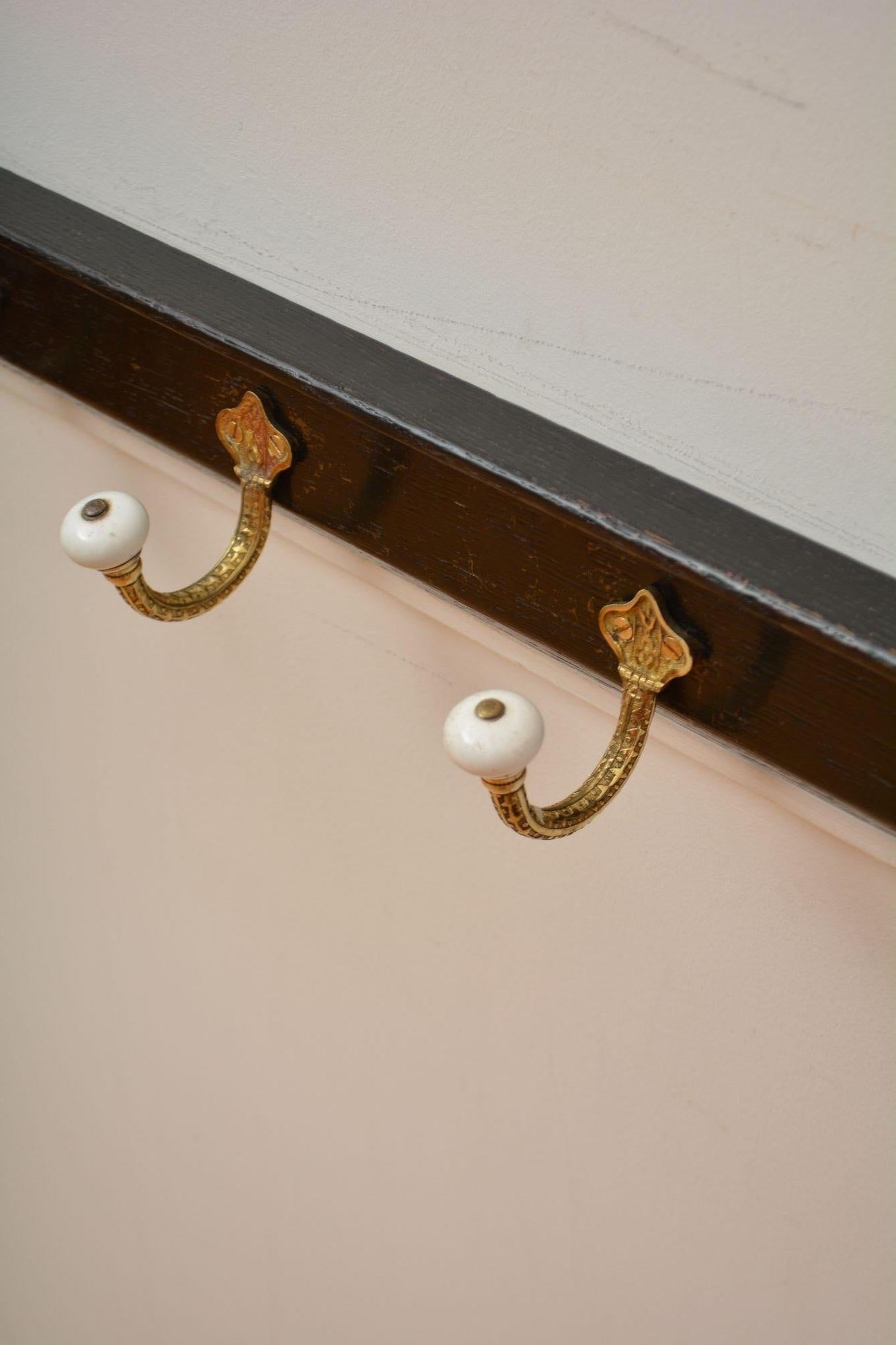 Brass and Ceramic Coat Hooks on Oak backing Coat Rack For Sale 1