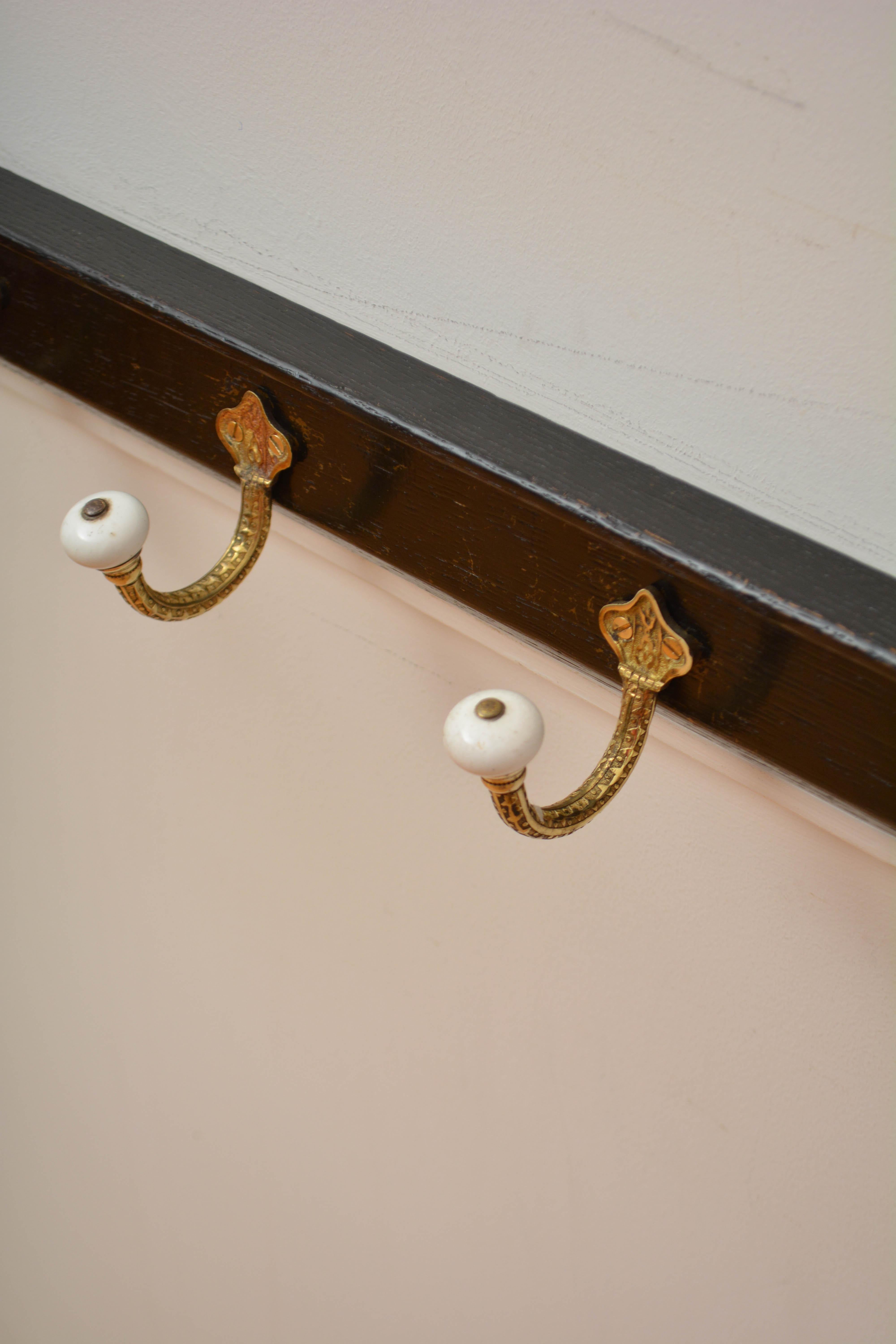 19th Century Brass and Ceramic Coat Hooks on Oak Ebonised Backing Coat Rack For Sale