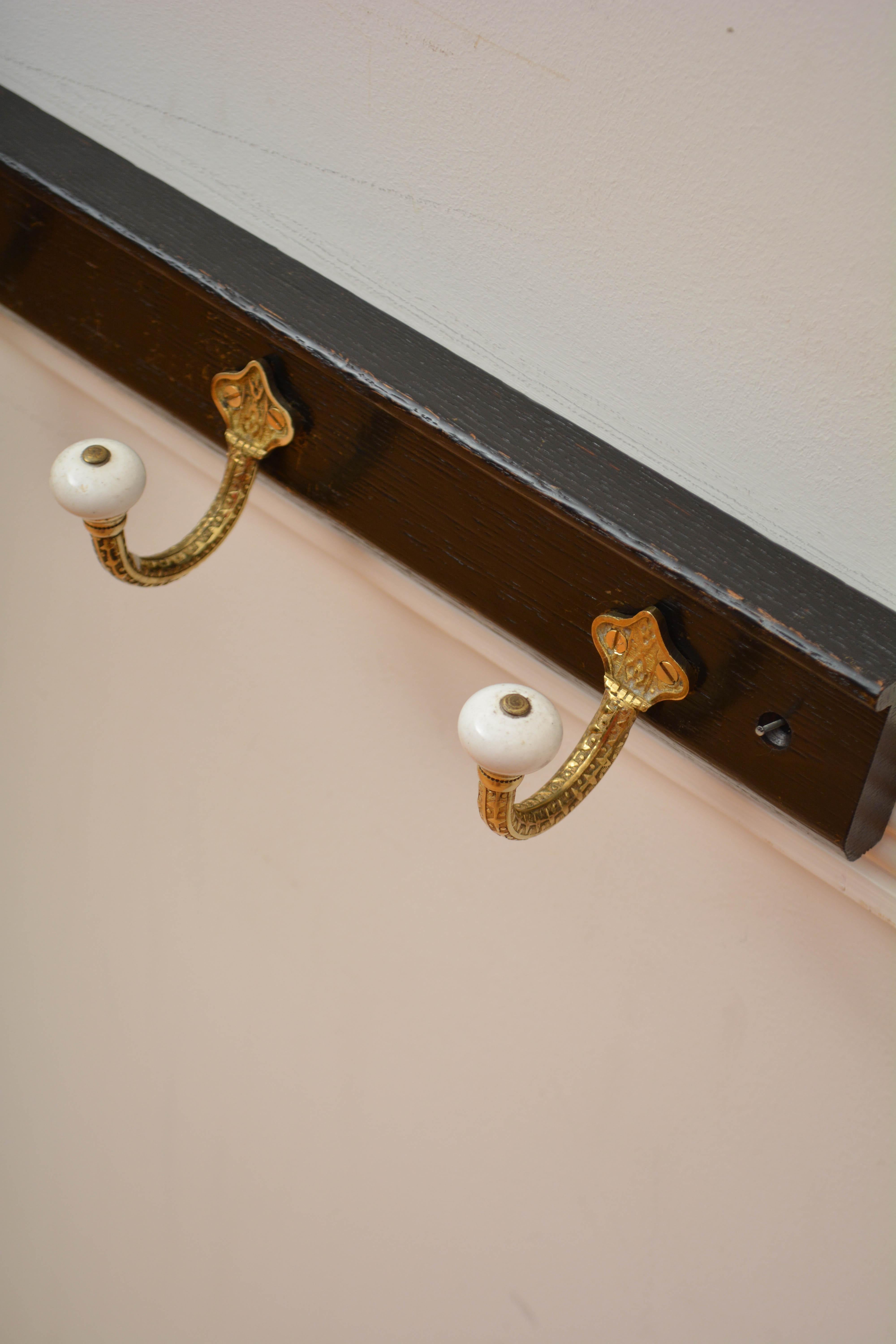 Brass and Ceramic Coat Hooks on Oak Ebonised Backing Coat Rack For Sale 1