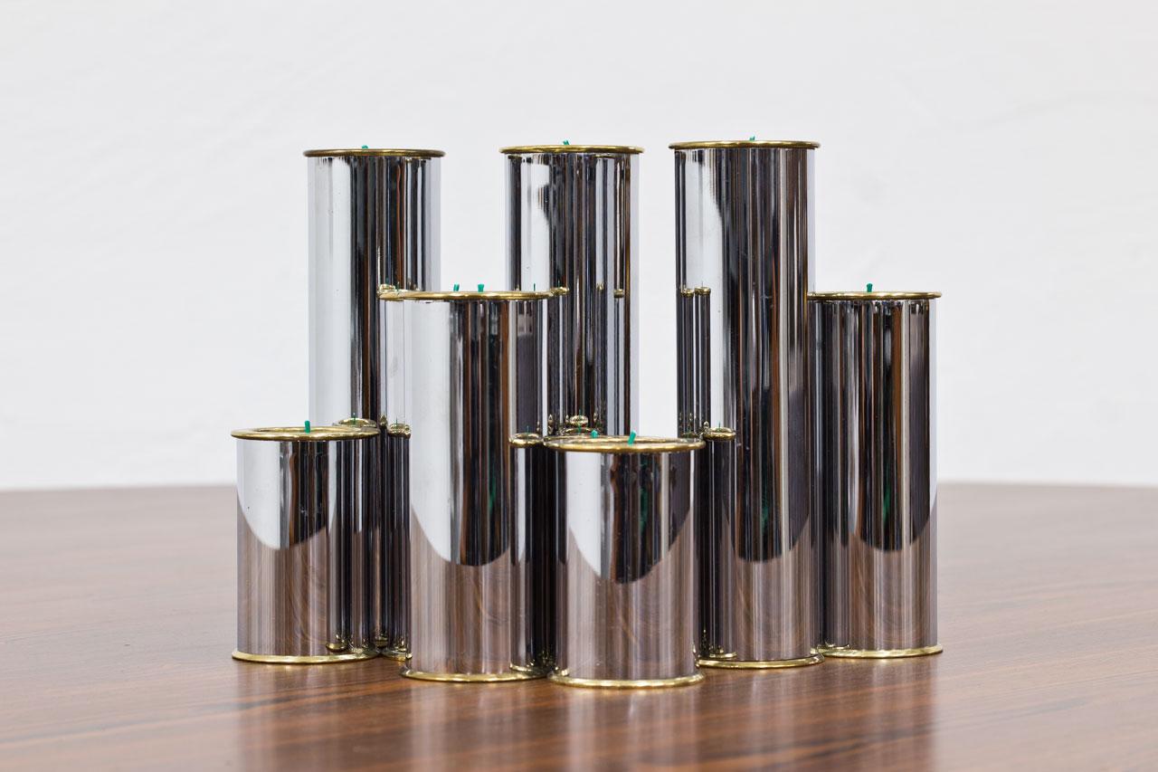 Group of 9 candlesticks, suitable for tea light candles. 
Manufactured by Englesson in Sweden during the 1970s. 
Made from brass and chrome-plated metal. 
Engraved underneath.

Dimensions:
Height 8 - 13 - 18.5cm.
Diameter 5.5cm.