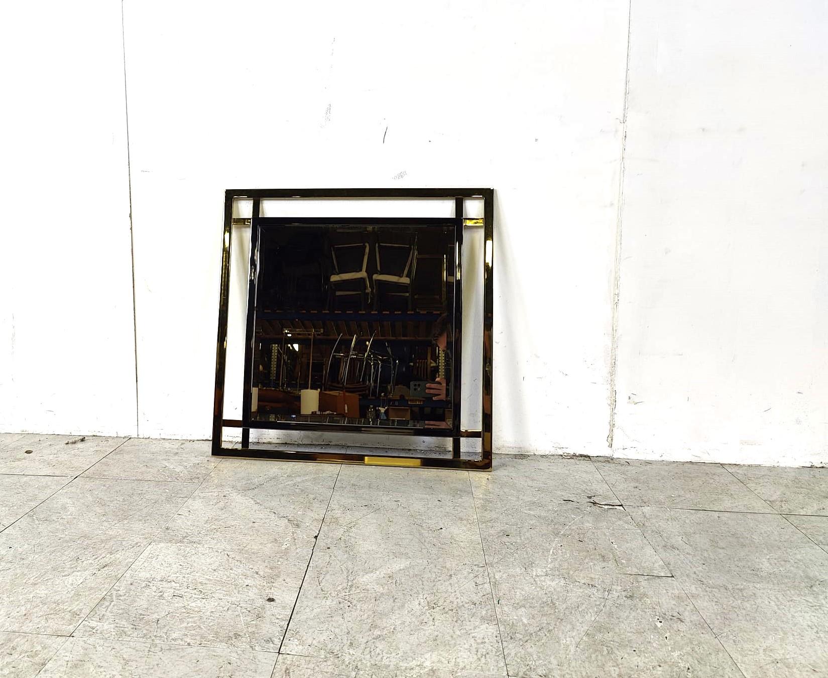 Beautiful geometrical brass and chrome mirror by Belgochrom with smoked mirror glass.

1970s - Belgium

Good condition

Width x height: 70cm

Ref.: 363655