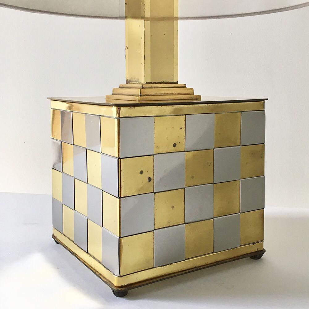 Brass and chrome patchwork woven block table lamp with steps upto the lamp's brass stem, all set on small ball feet 1970s.
 