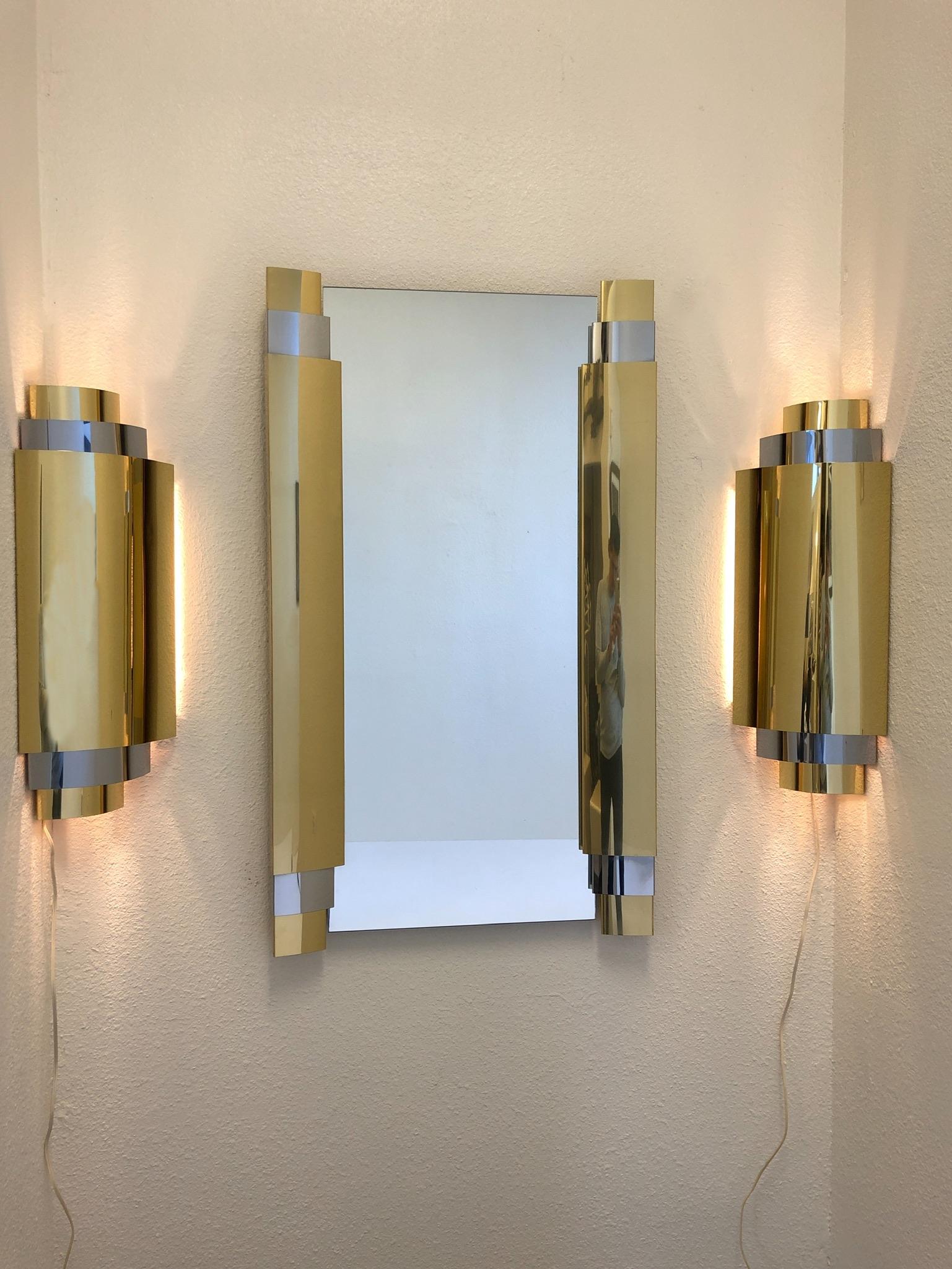 Polished Brass and Chrome Wall Mirror and Scones by Curtis Jere For Sale