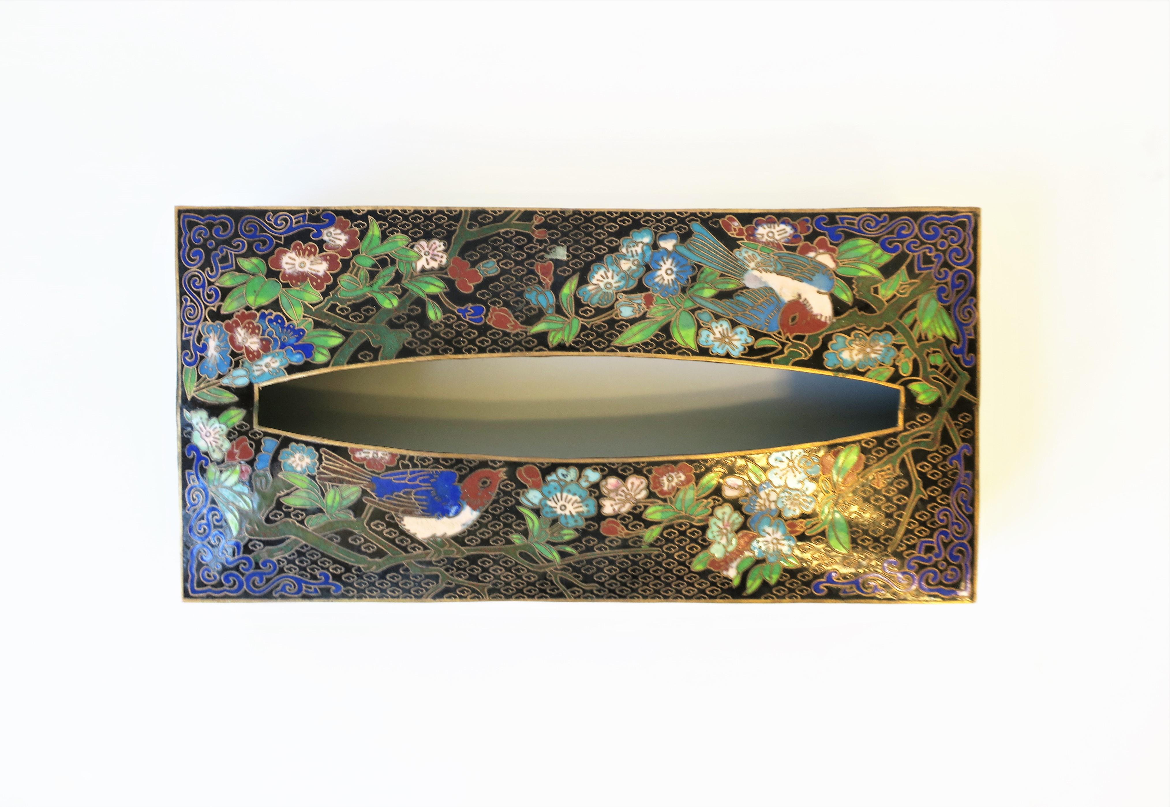 A beautiful brass and cloisonné enamel tissue box holder cover with birds and flowers, circa 1970s, China. Colors include: gold brass, black, cobalt blue, sapphire blue, light blue, white, emerald green, greens, pink, and red burgundy enamel hues.