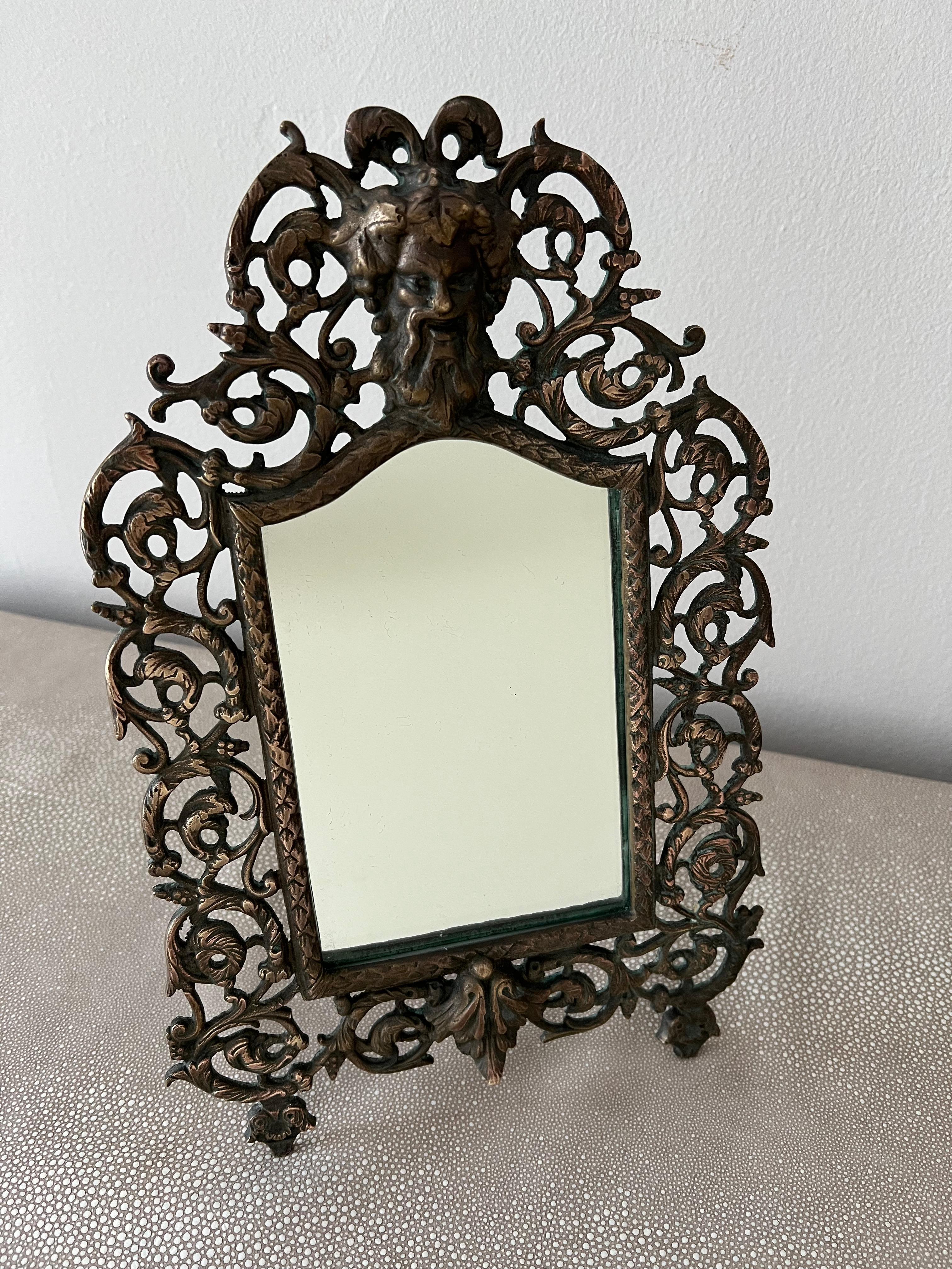 A wonderful table mirror by P. E. Guerin. 19th C., heavy and made with fine details -the back has what looks to be a leather back? The backing is held in with small finish nails and the decorative stand is copper... a wonderful piece for many areas