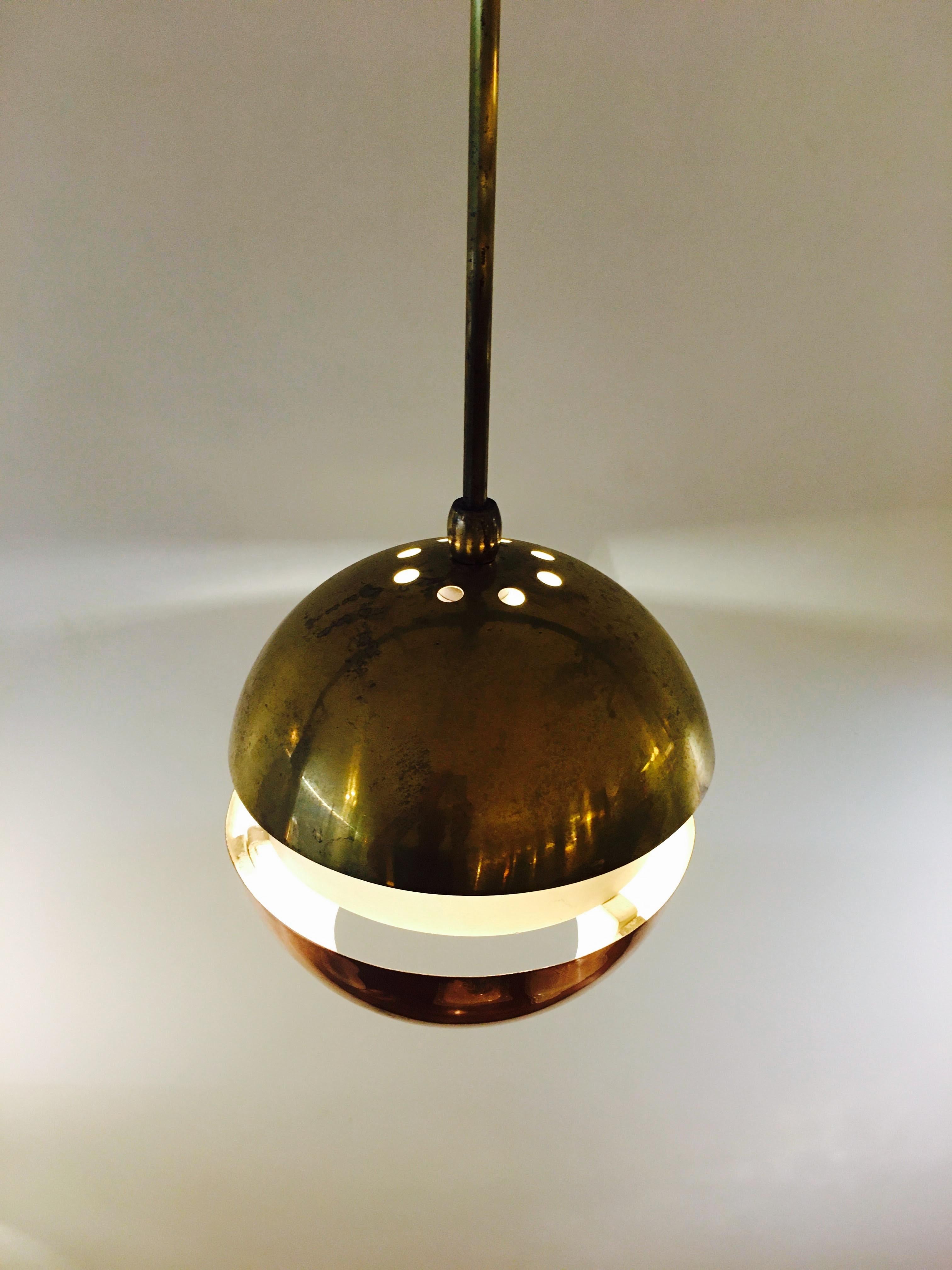 Brass and copper spherical/globe shape pendants
The relationship between copper and brass is particularly interesting when illuminated.
Mid-Century Modern
Scandinavian Modern.