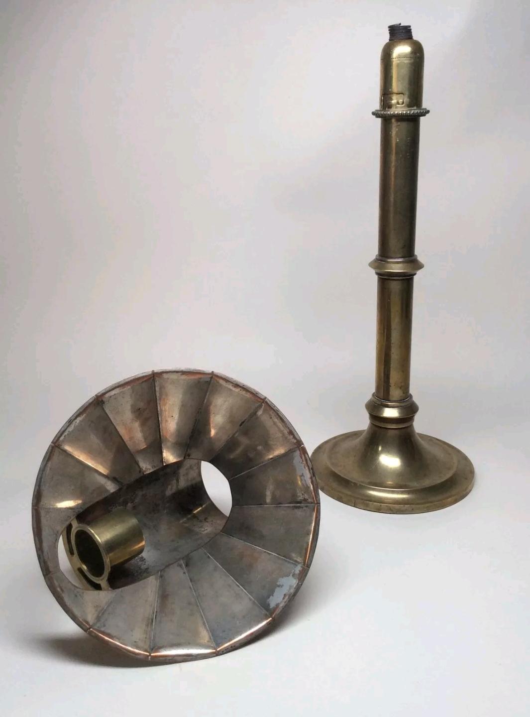 A very good example of this late Victorian spring loaded students candle stand with copper reflector hood that has a silvered reflective surface on the inside. The spring is original and working well, it has not been polished so it retains a nice