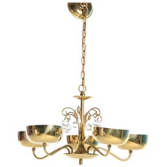 Lustre en laiton et cristal dans le style de Paavo Tynell