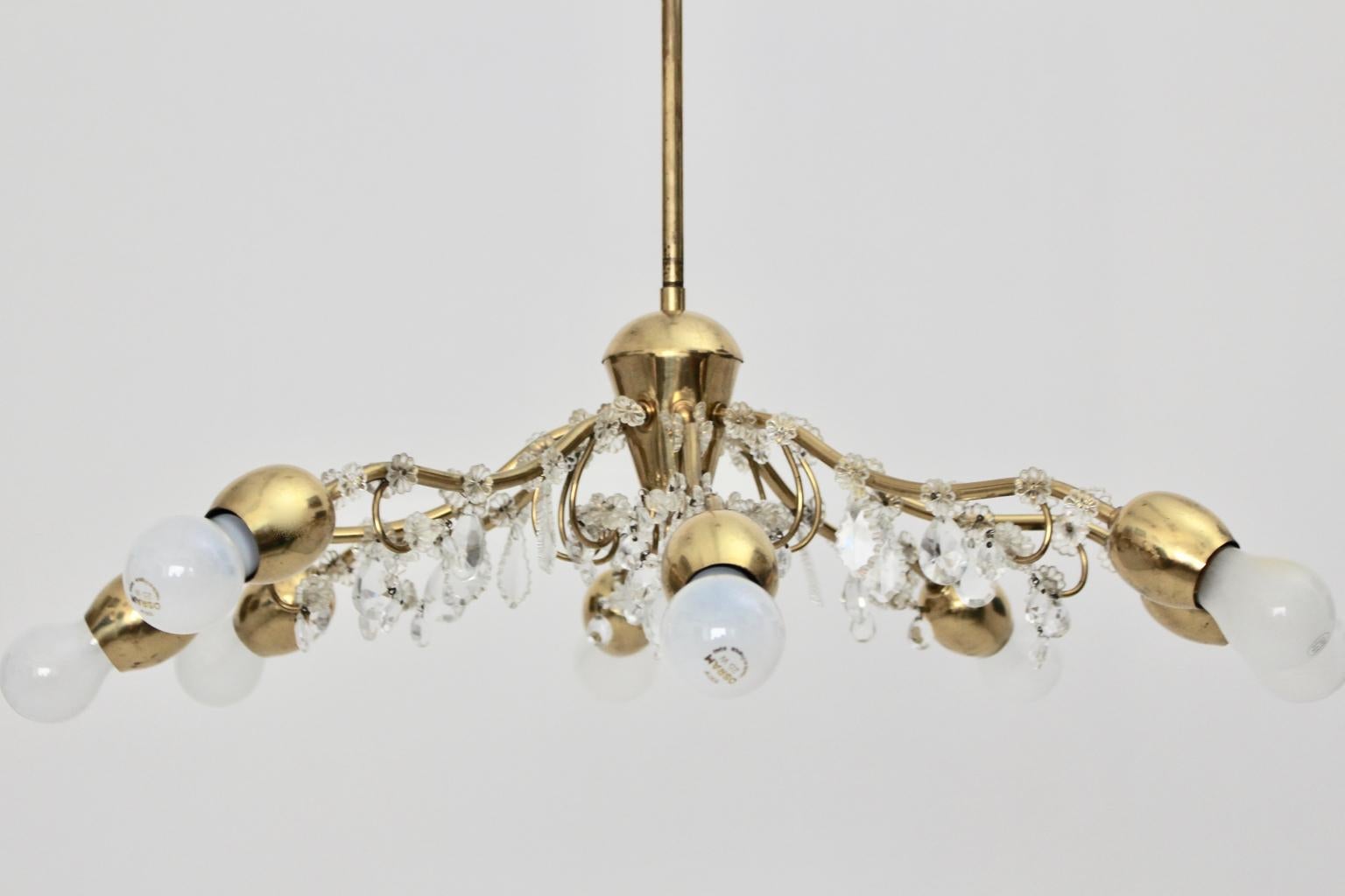 This lovely chandelier, which was designed and manufactured by the firm J & L Lobmeyr Vienna in the 1950s shows a brass chandelier frame.
Furthermore the brass chandelier frame with 8 arms and E 27 sockets was been decorated with cut Swarovski