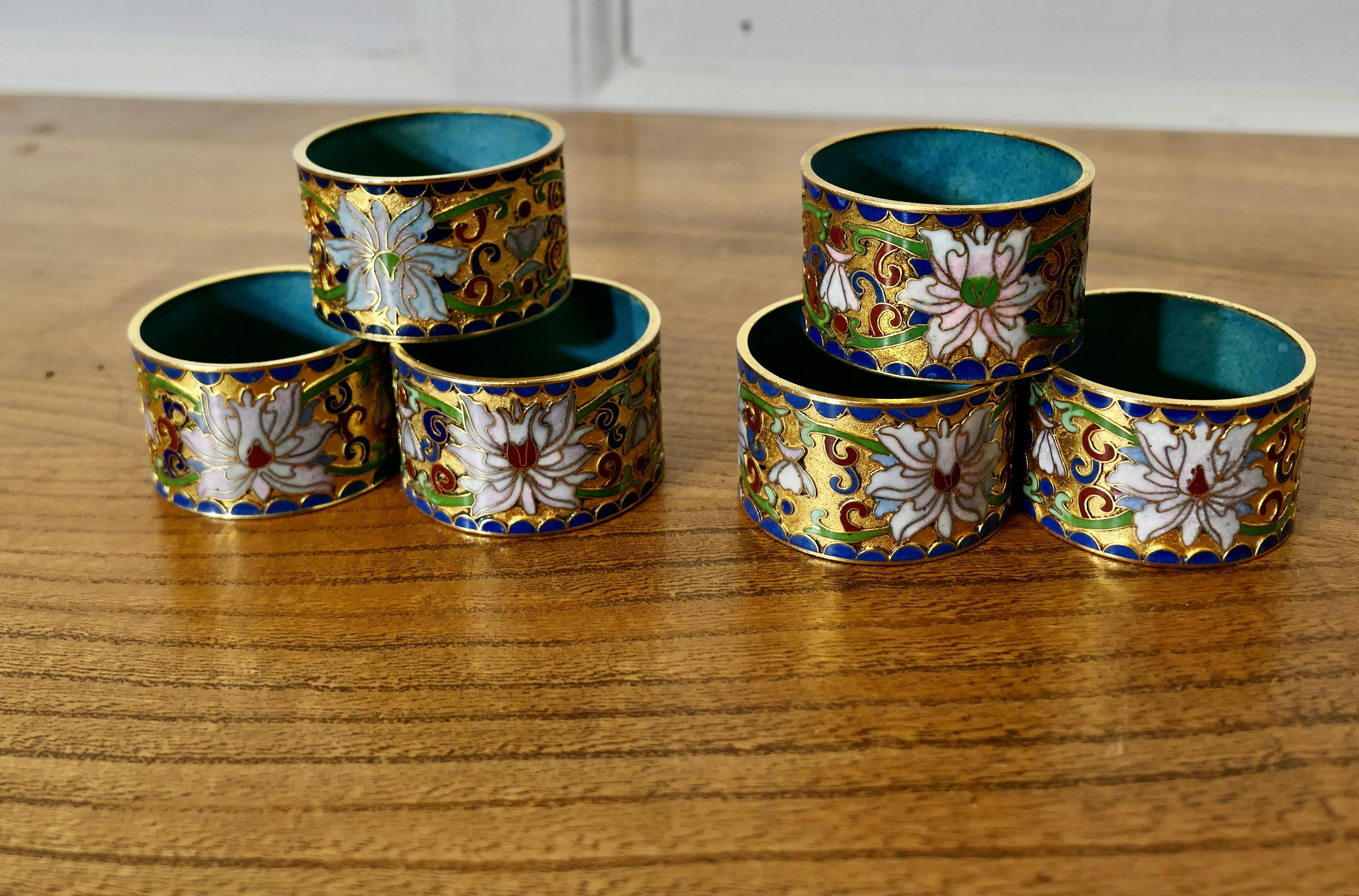 Brass and Enamel Indian Serviette Rings

A lovely set of Napkin Rings, made in brass with relief enamelling in bright colourful flower patterns, each ring is slightly different so you can all recognise your own one
A lovely set, the rings are 1”