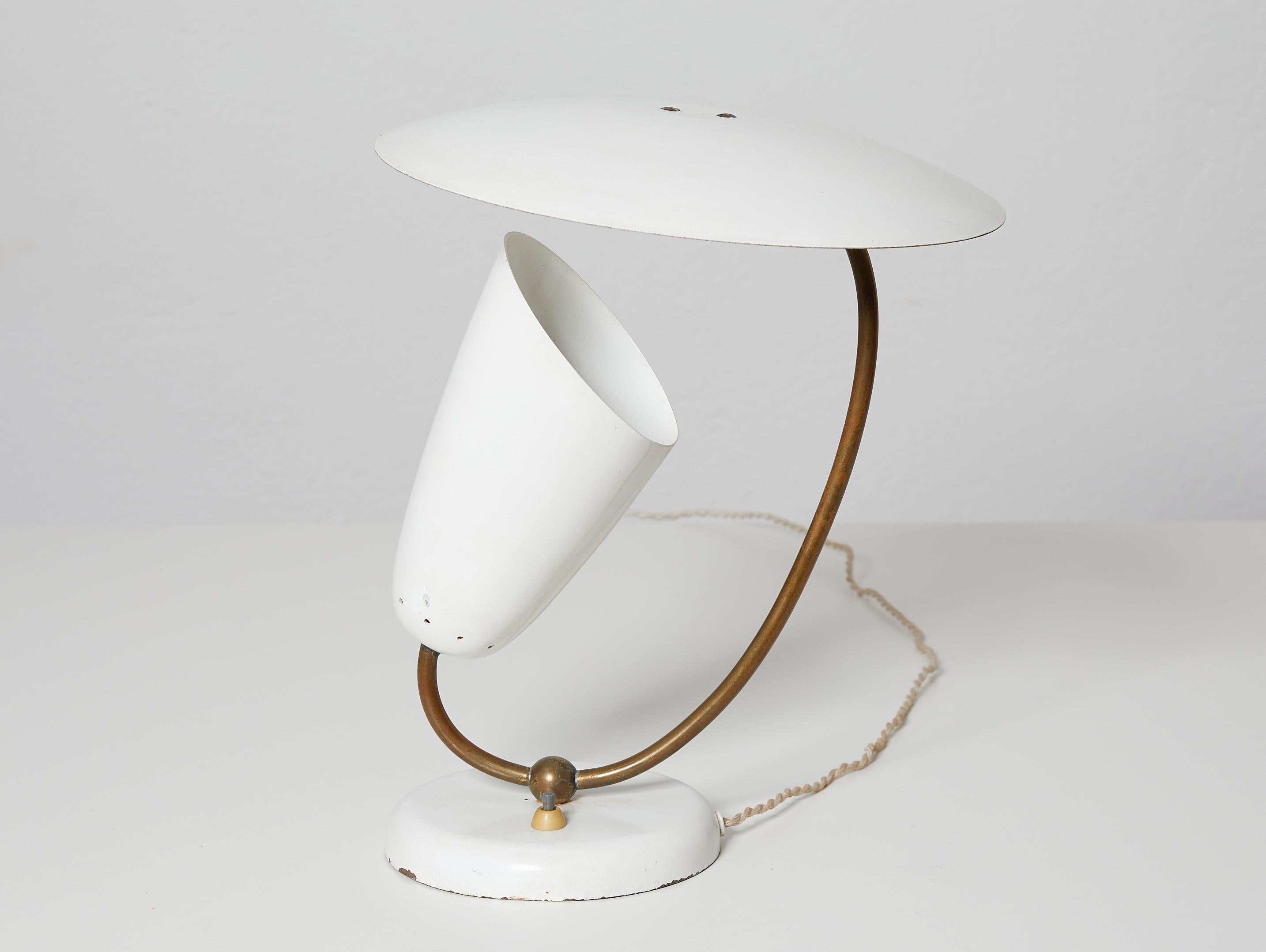 Brass and enameled metal table lamp, Stilnovo inspired, Switzerland 1950.

This swiss lamp probably from BAG Turgi or Belmag, is clearly inspired by the Stilnovo production of the 50ties. 
The light is softly and beautifully diffused creating a very