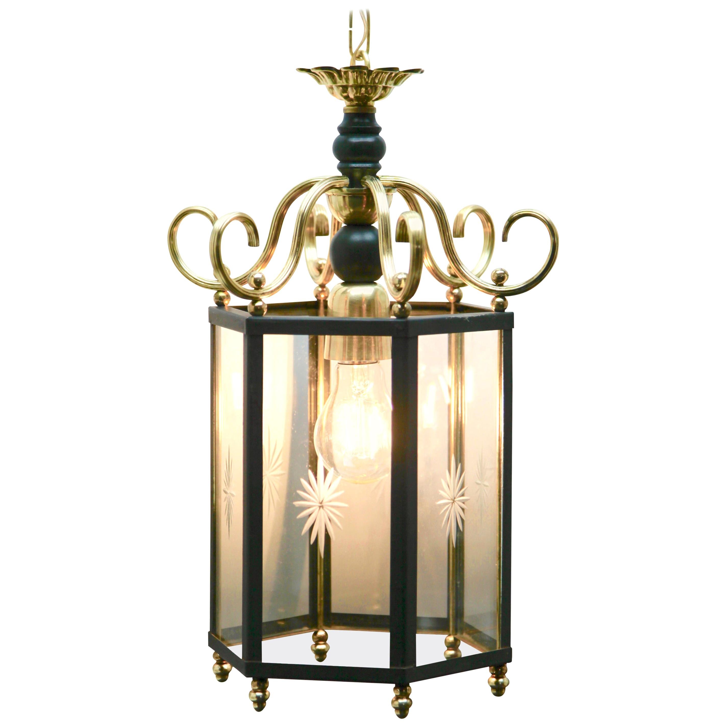 Early 20th century brass and etched glass lantern hall light; this Classic design will suit a wide range of interior period-styles.
Ife wanted there are 3 the same in stock.

The light has 6 clear glass panels, each one etched with a starburst