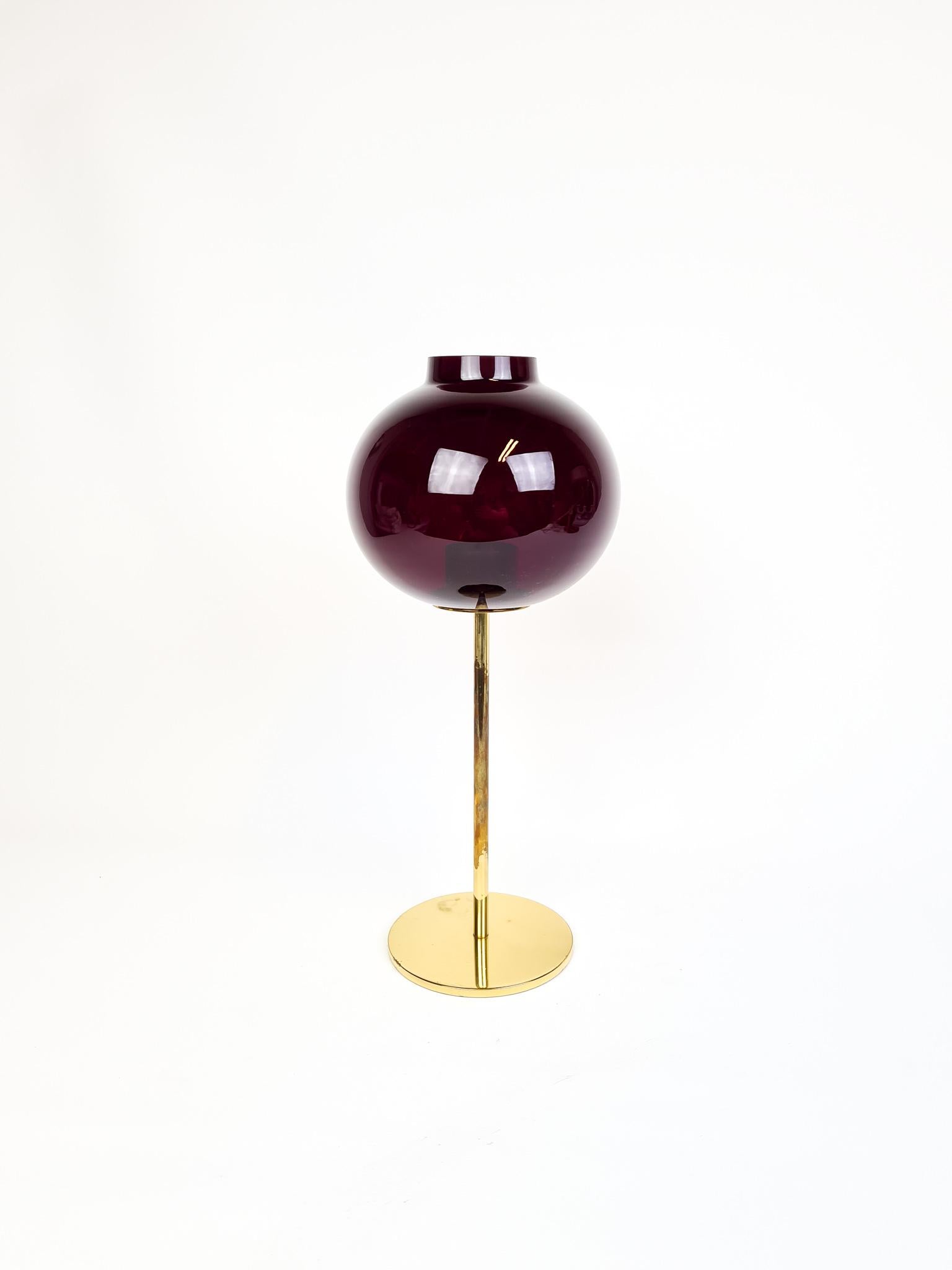 This candleholder was made in Sweden, 1960s and designed by Hans-Agne Jakobsson. It’s in brass and the top is made of Redglass. 

It’s in good condition, the brass with some wear.

Measures H 33 cm, D 14 cm.
