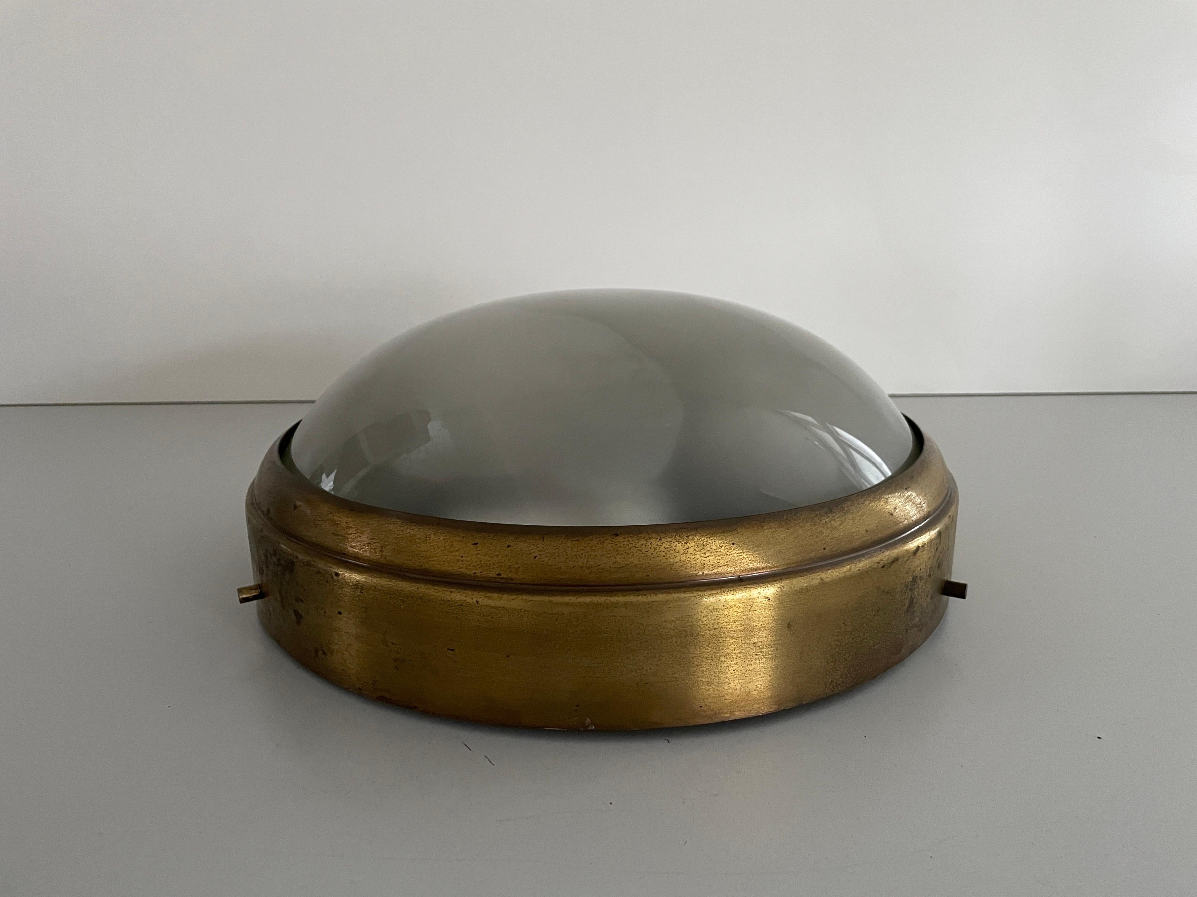 Brass and Glass Ceiling Lamp Flush Mount, 1960s, Italy

Lampshade is in very good vintage condition.

This lamp works with 3x E27 light bulbs. 
Wired and suitable to use with 220V and 110V for all countries.

Measurements:
Diameter: 36 cm
Height: 14