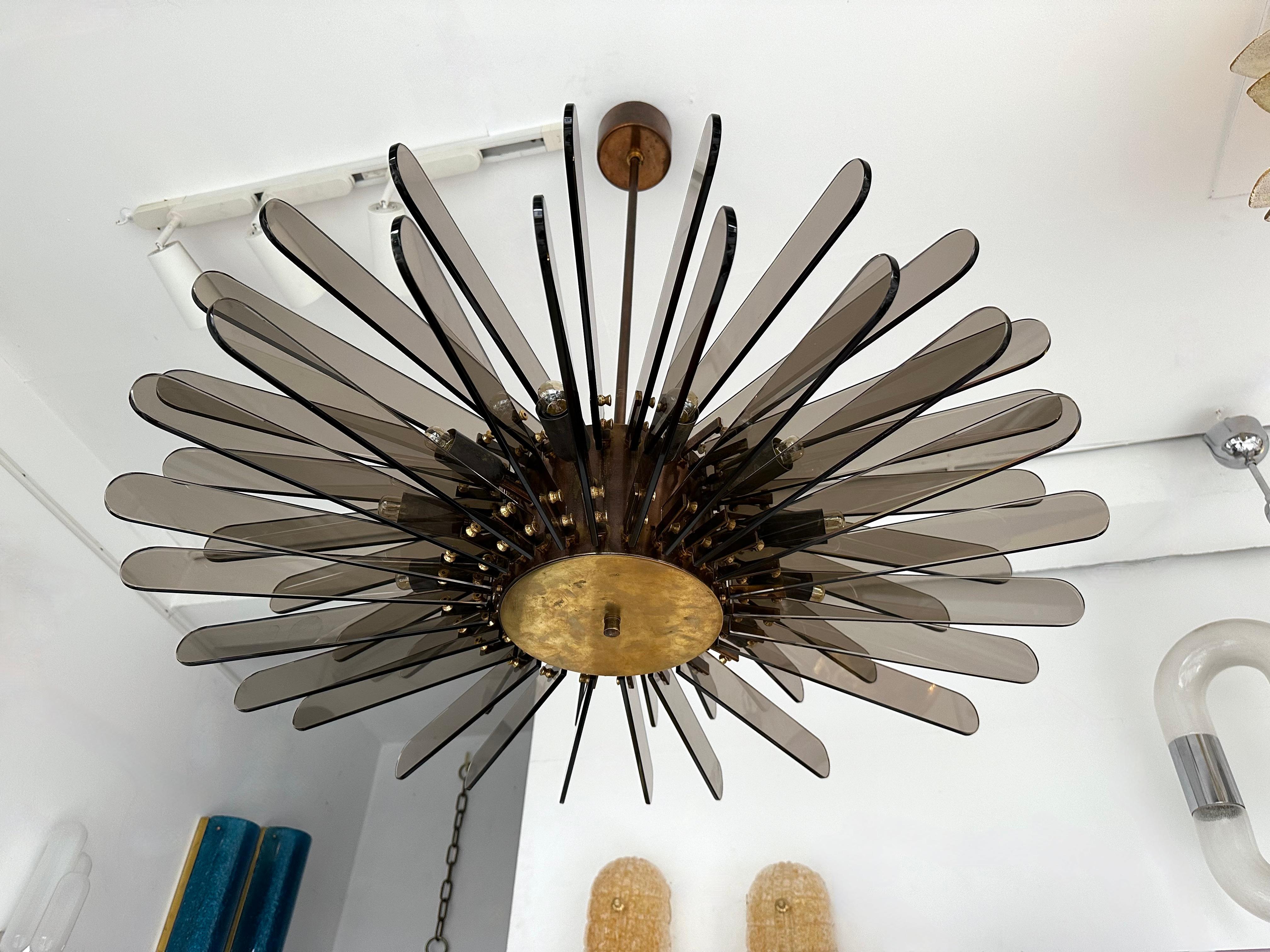 Chandelier ceiling pendant light lighting lamp in brass and glass blade by Gino Paroldo. Famous deisgn like Stilnovo, Vistosi, Venini, La Murrina, Seguso, Sciolari, Reggiani, Lumica, Aldo Carlo Nason for Mazzega, Stilkronen, Staff.