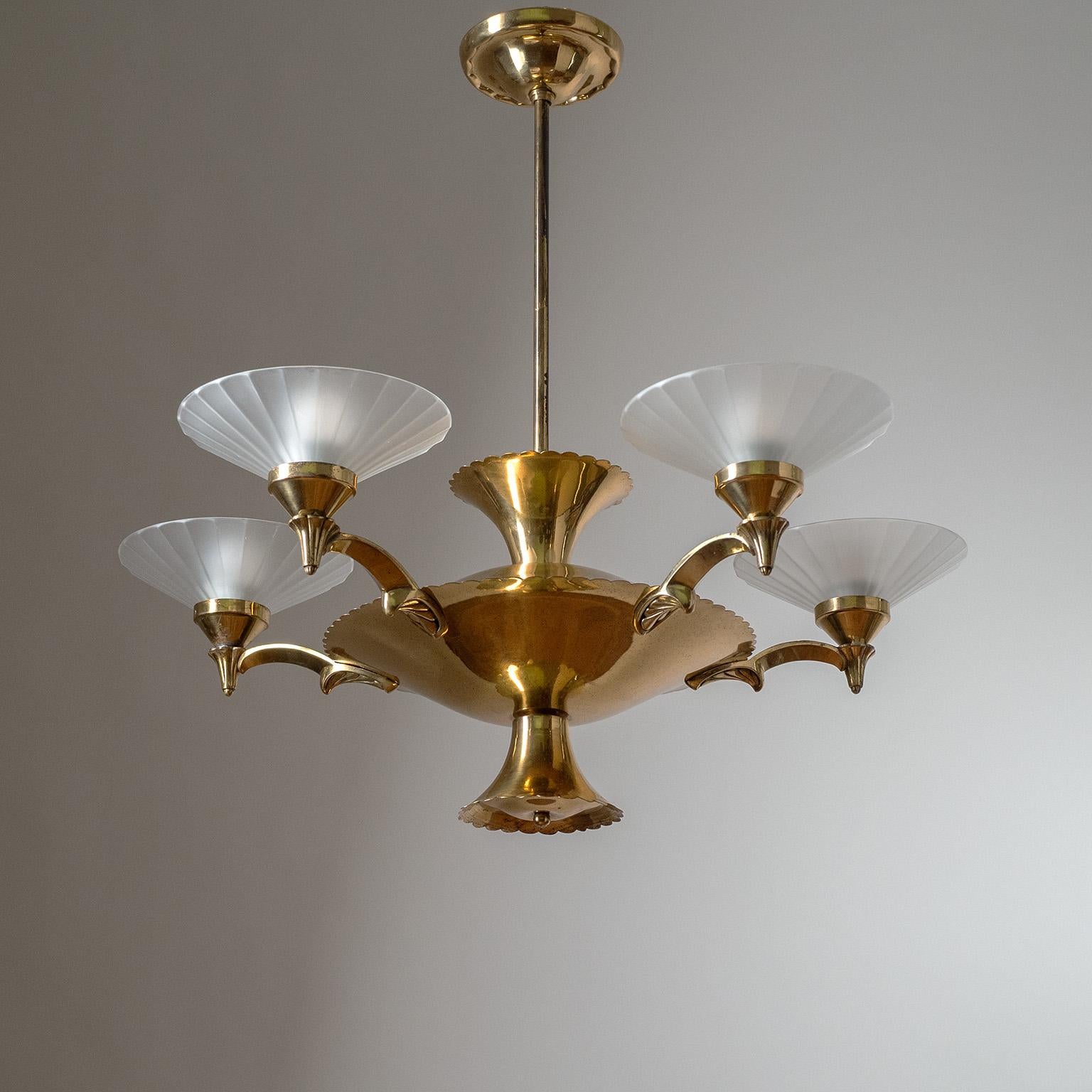 Fine Austrian brass and glass Art Deco chandelier from the 1930-1940s. Five cast-brass arms with satin glass diffusers are attached to a large brass disc-shaped body with scalloped edges and details. Very good overall condition with minor patina on