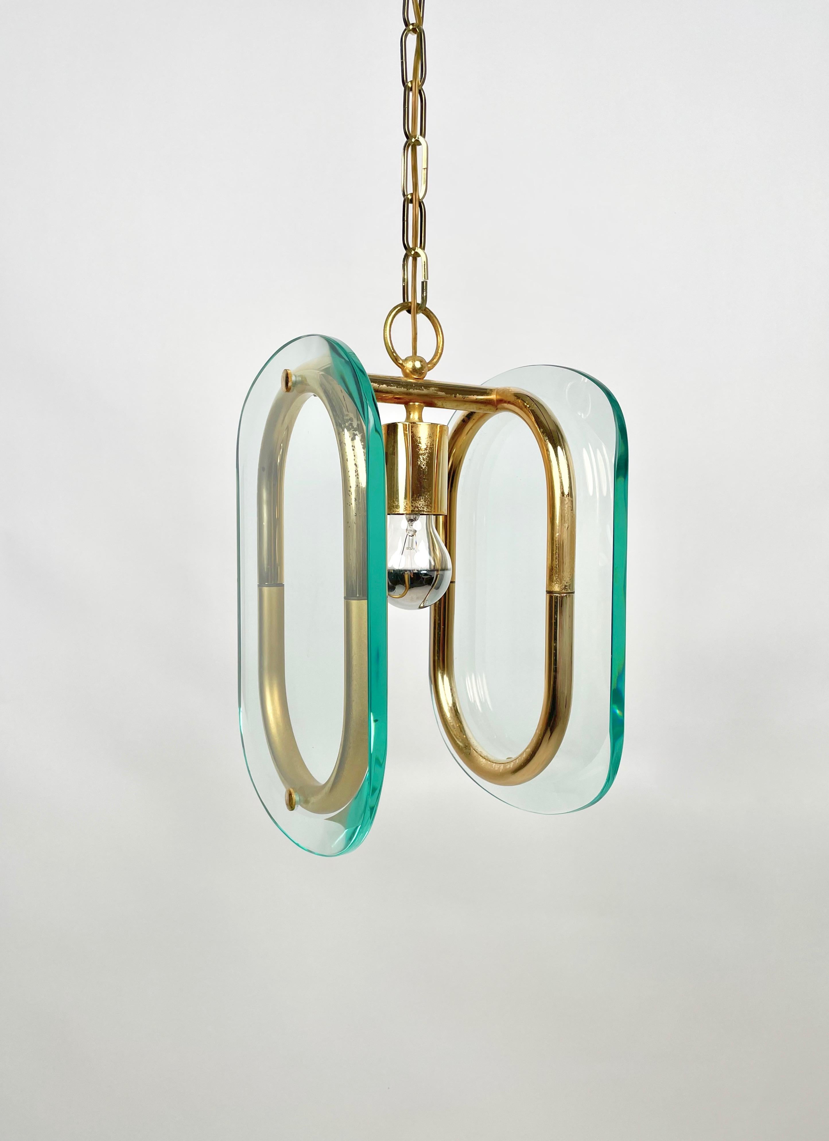 Chandelier featuring brass structure and chain and two oval glass in the style of Fontana Arte. Made in Italy in the 1970s. 

Measures: Height with chain: 90 cm. 
Height without chain: 37 cm.
 