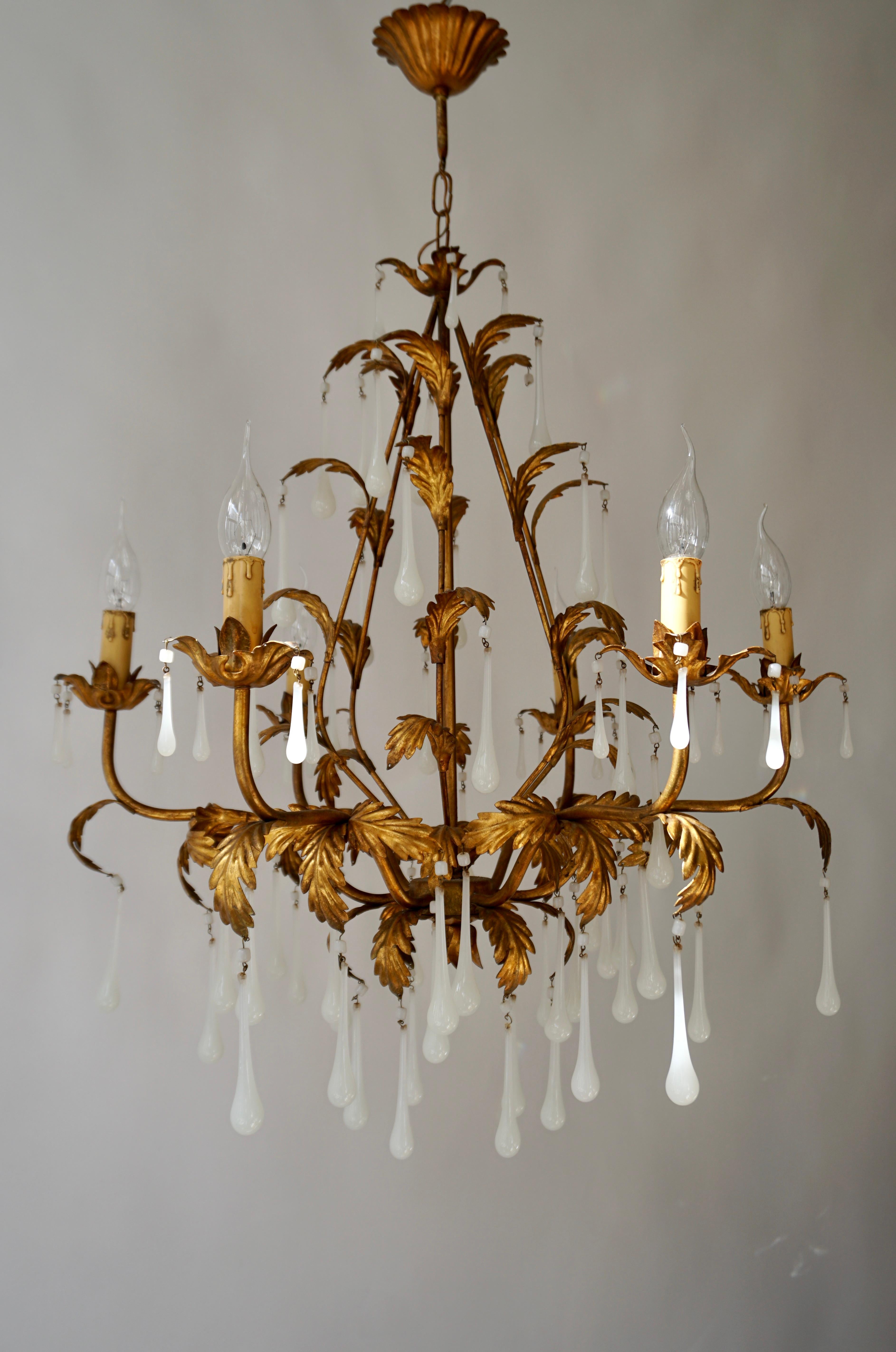 Italian brass teardrop chandelier with opaline glass.

The light requires six single E14 screw fit lightbulbs (60Watt max.) LED compatible.

Diameter 68 cm.
Height fixture 70 cm.
Total height 90 cm.



