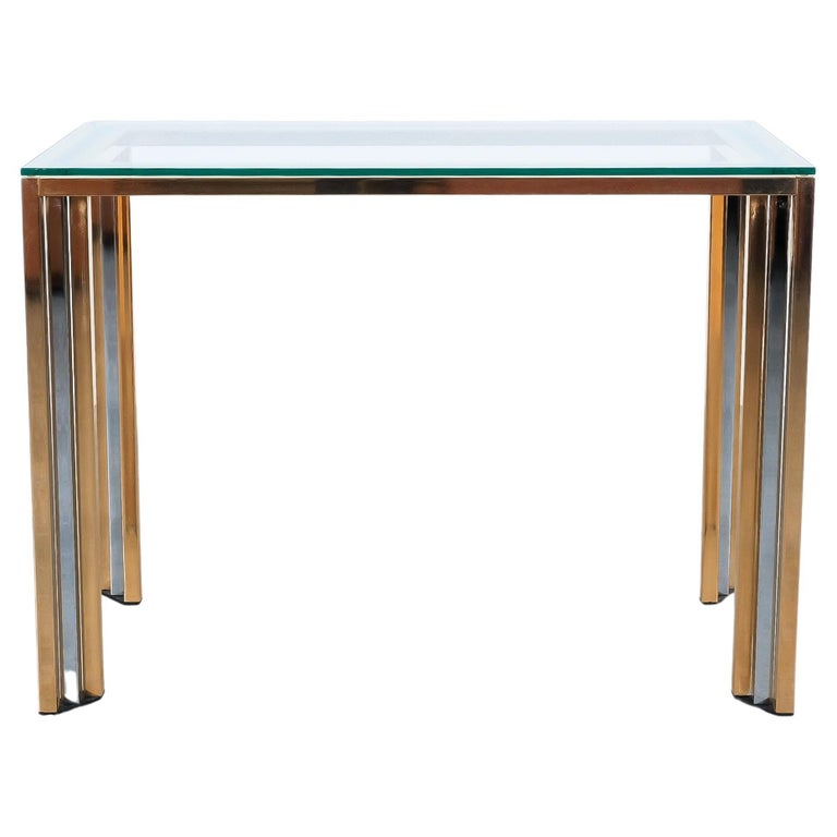 Brass and chrome console table with a glass top, Italy mid-century

Very well preserved console table with inwards turned bundle pillar feet. Very good overall condition, no chips or major flaws.

Dimensions 39.37