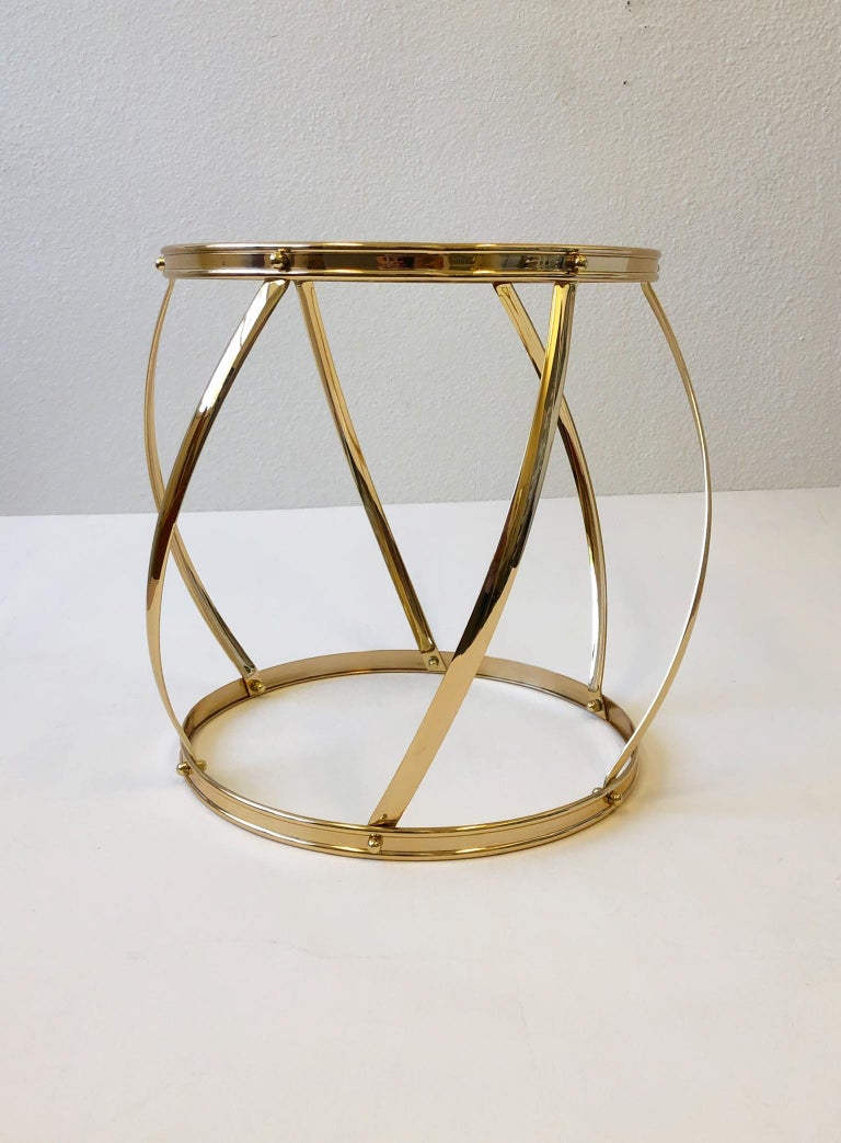 Glamorous 1970’s polish brass and glass drum side table.
Newly professionally polished and new glass top.
Measurements: 17.5” high and 19.75” diameter.