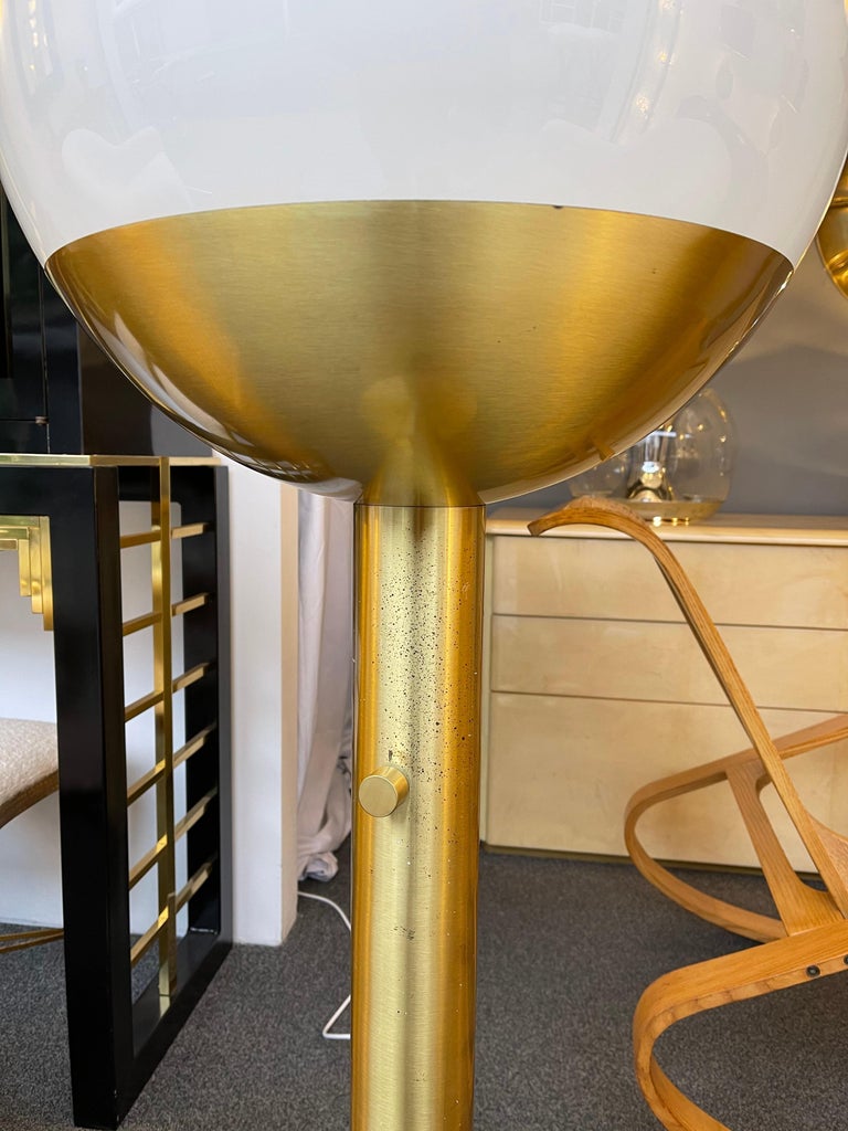 Brass and Murano opaline glass ball floor lamp model P428 by Pia Guidetti Crippa for the editor LUCI Illuminazione di interni. Famous design like Sciolari, Reggiani, Willy Rizzo, Stilux, Lumi, Arteluce, Stilnovo.