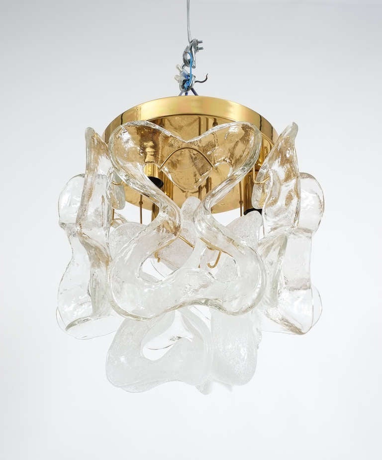 Fantastic brass and glass flushmount light fixture by Kalmar with 2 layers of thick hand blown glass loop elements (clear and tranclucent). The light is in very good condition and has got three light sources.