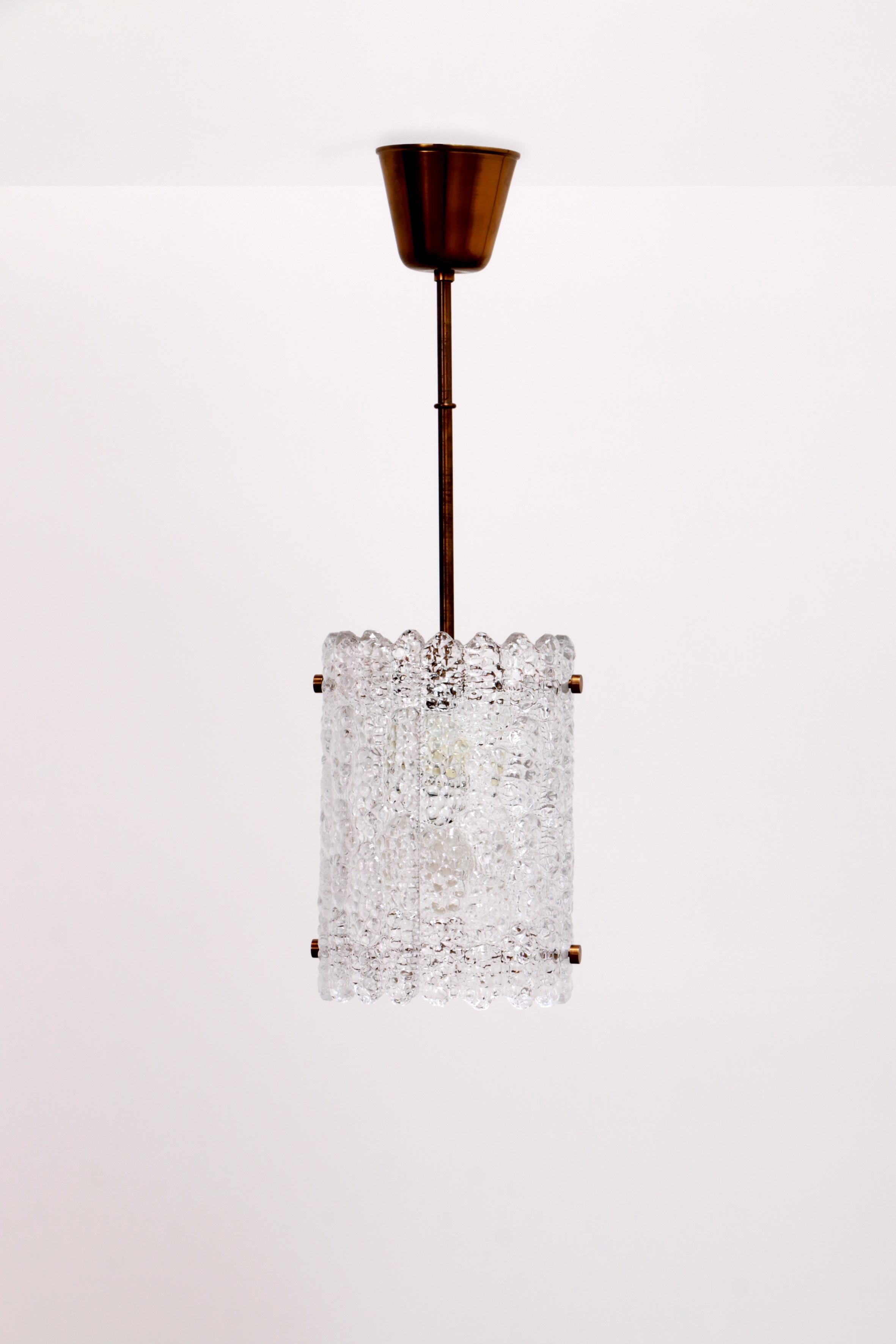 Brass and glass hanging lamp by Carl Fagerlund for Orrefors, Sweden

Ceiling lamp designed by Carl Fagerlund, manufactured by Orrefors in Sweden in the 1960s.

Brass structure with glass diffuser.

This is a beautiful solid glass hanging lamp with a