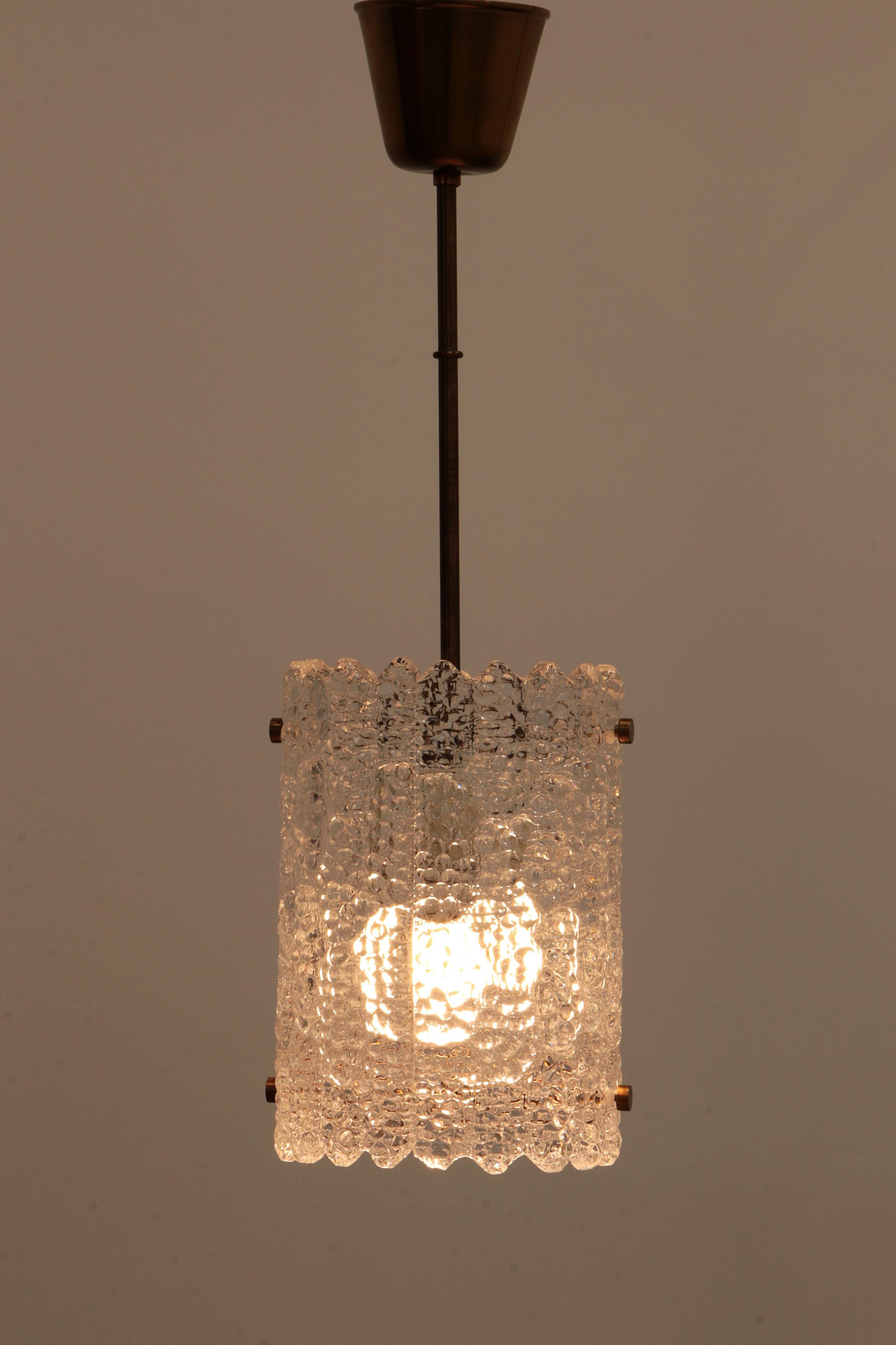Swedish Brass and glass hanging lamp by Carl Fagerlund for Orrefors, Sweden For Sale
